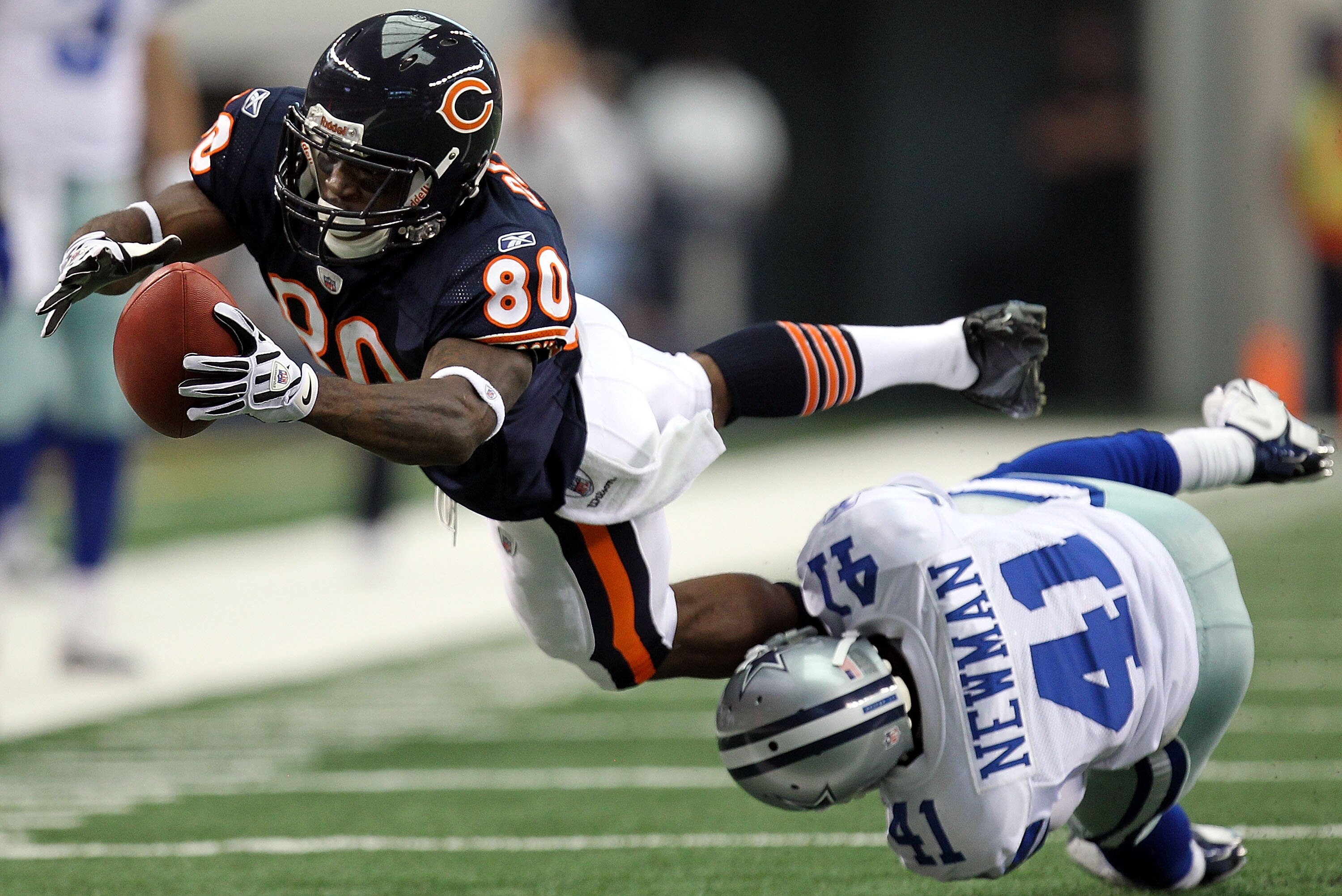 ARLINGTON, TX - SEPTEMBER 19:  Wide receiver Earl Bennett #80 of the Chicago Bears dives for extra yardage while tackled by Terence Newman #41 of the Dallas Cowboys at Cowboys Stadium on September 19, 2010 in Arlington, Texas.  (Photo by Ronald Martinez/G