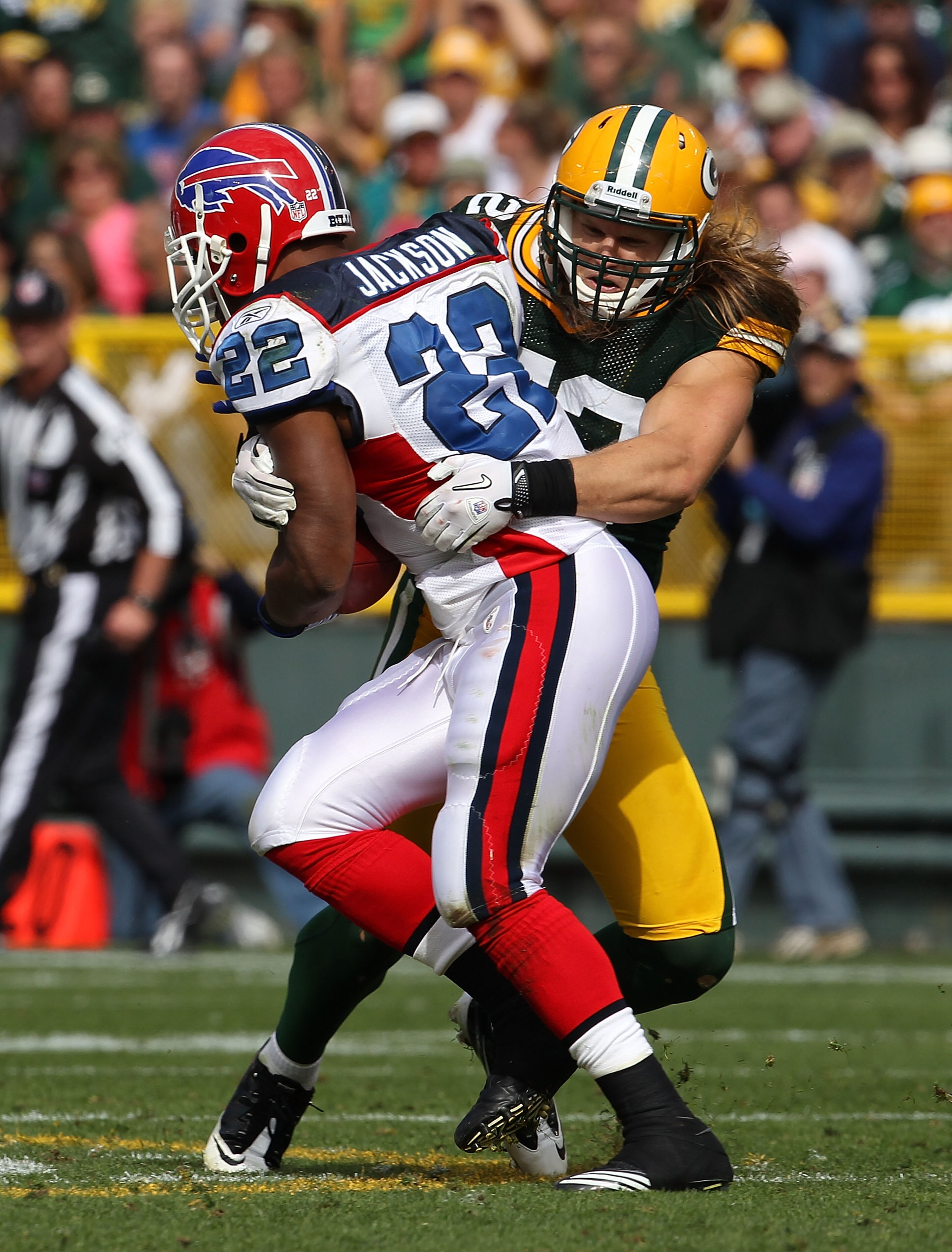 GREEN BAY, WI - SEPTEMBER 19: Clay Matthews #52 of the Green Bay Packers tackles Fred Jackson #22 of the Buffalo Bills at Lambeau Field on September 19, 2010 in Green Bay, Wisconsin. The Packers defeated the Bills 34-7. (Photo by Jonathan Daniel/Getty Ima