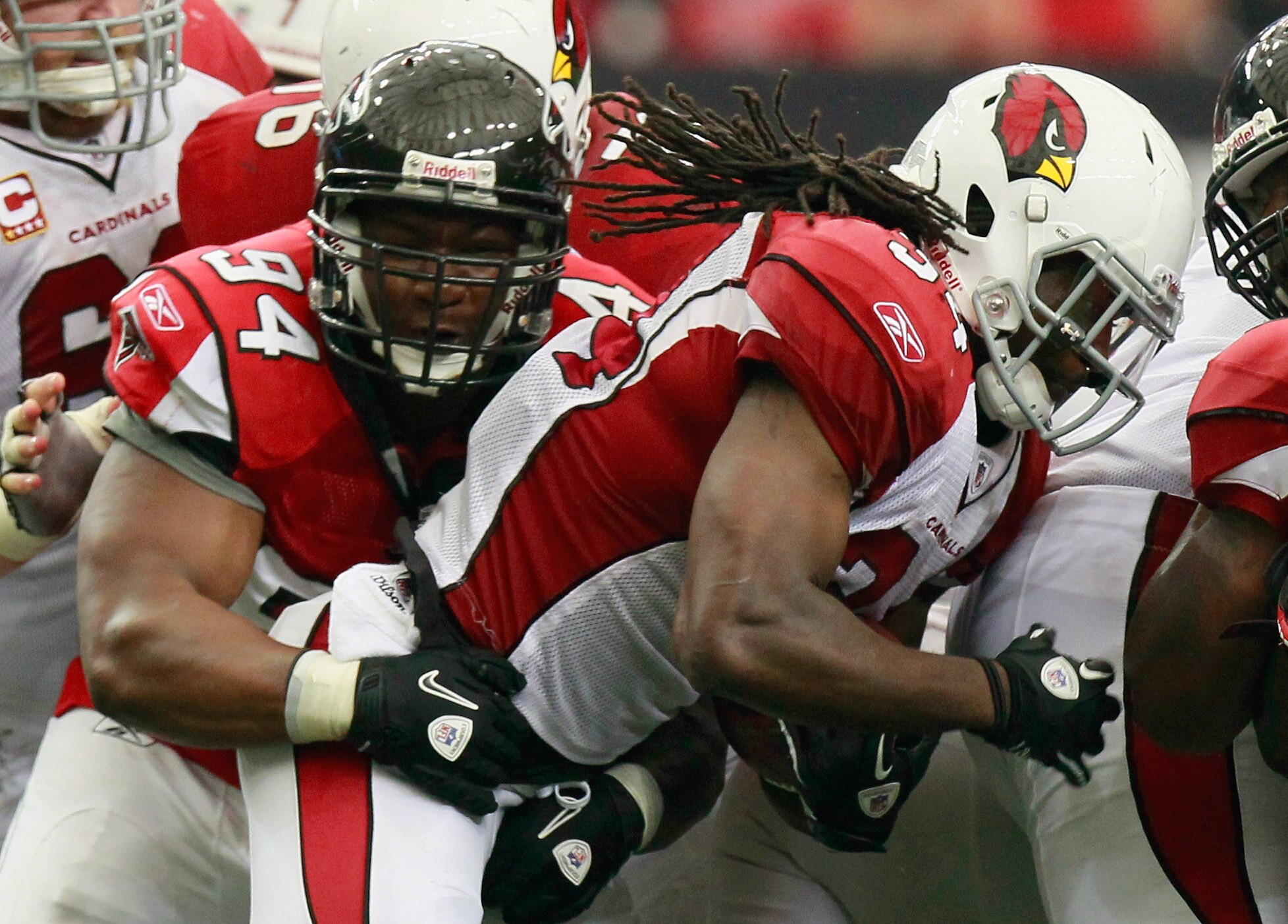 ATLANTA - SEPTEMBER 19:  Tim Hightower #34 of the Arizona Cardinals is tackled by Peria Jerry #94 of the Atlanta Falcons at Georgia Dome on September 19, 2010 in Atlanta, Georgia.  (Photo by Kevin C. Cox/Getty Images)