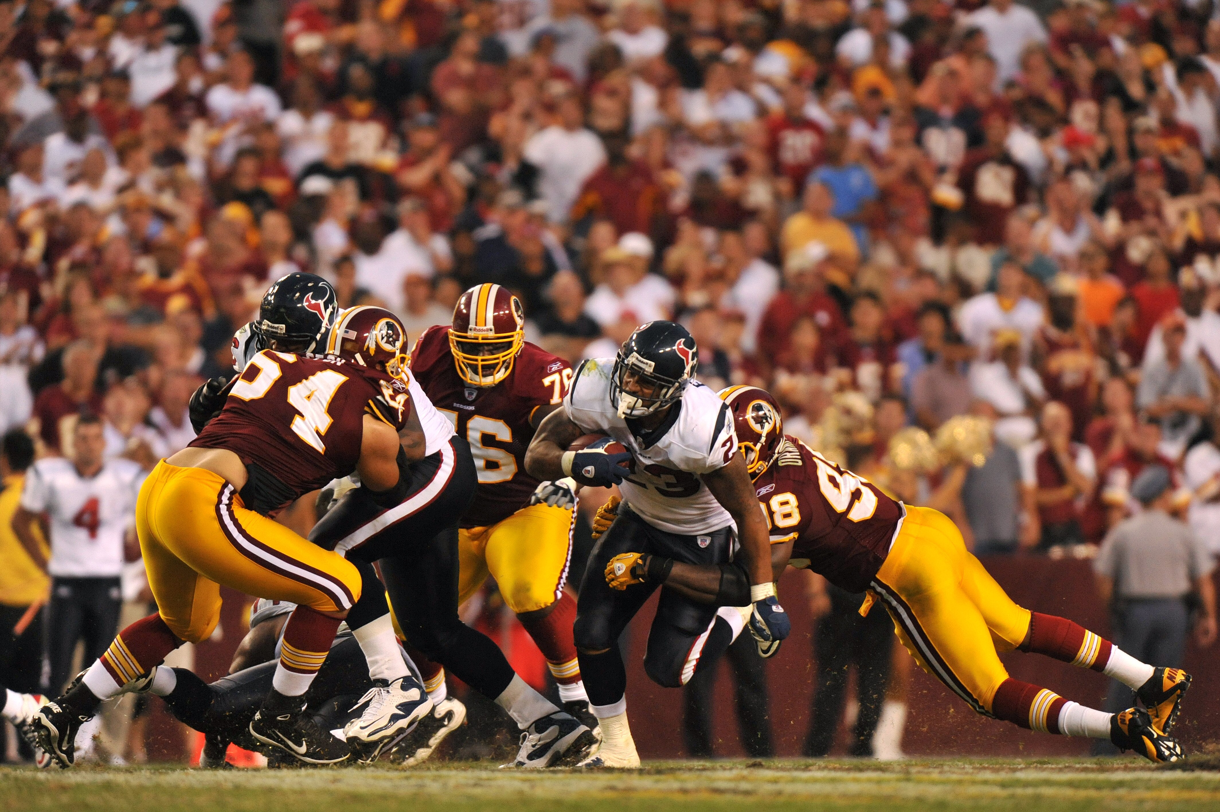 LANDOVER - SEPTEMBER 19:  Arian Foster #23 of the Houston Texans runs the ball against the Washington Redskins at FedExField on September 19, 2010 in Landover, Maryland. The Texans defeated the Redskins 30-27 in overtime. (Photo by Larry French/Getty Imag