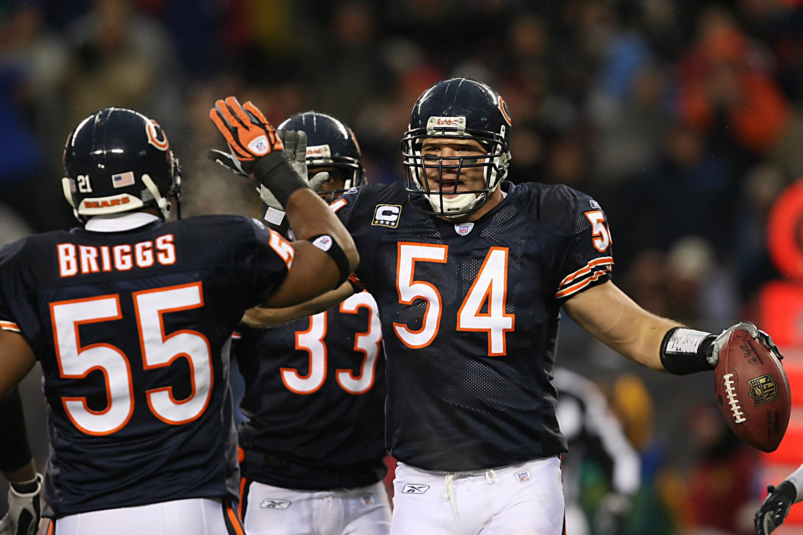 CHICAGO - DECEMBER 2:  Lance Briggs #55 and Brian Urlacher #54 of the Chicago Bears high five each other during the NFL game against the New York Giants at Soldier Field on December 2, 2007 in Chicago, Illinois. (Photo by Jonathan Daniel/Getty Images)
