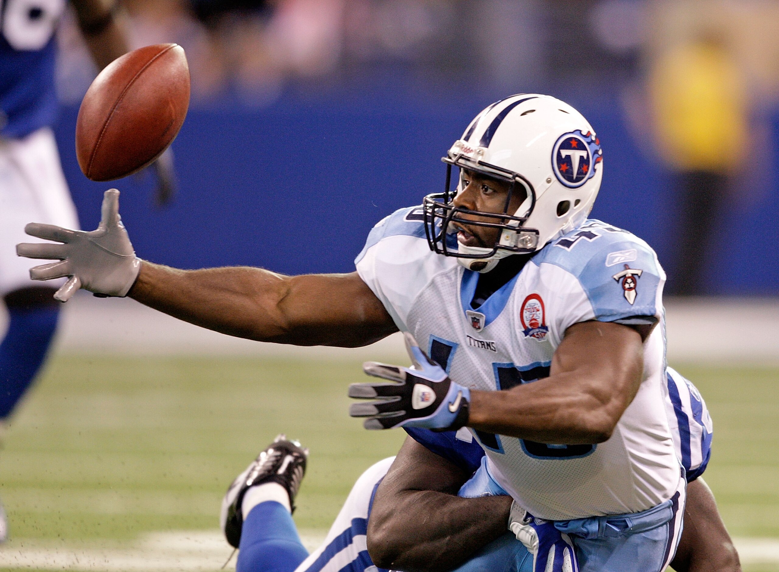INDIANAPOLIS - DECEMBER 06:  Ahmard Hall #45 of  the Tennessee Titans fumbles the ball during the NFL game against the Indianapolis Colts at Lucas Oil Stadium on December 6, 2009 in Indianapolis, Indiana.  (Photo by Andy Lyons/Getty Images)