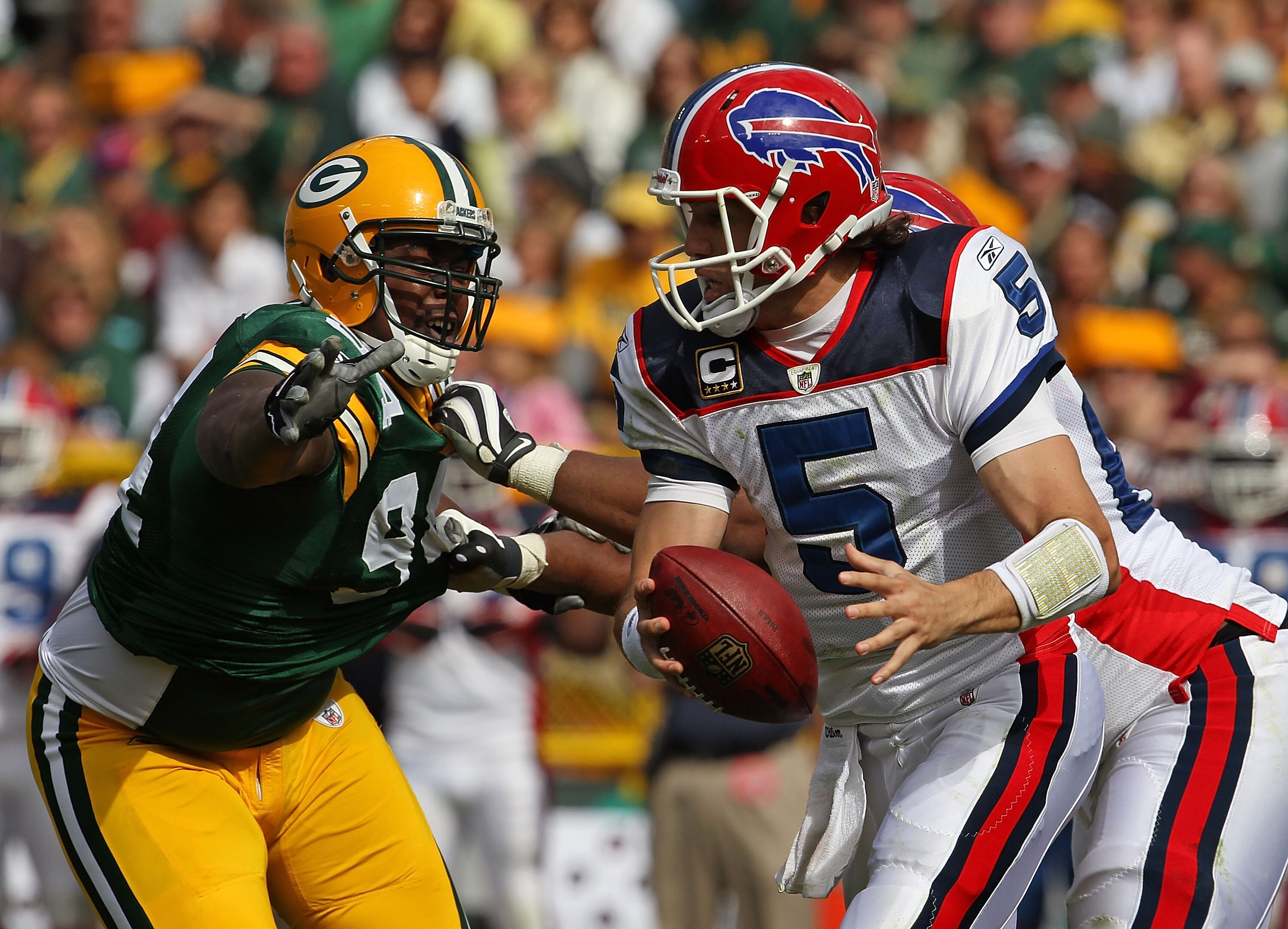 GREEN BAY, WI - SEPTEMBER 19: Trent Edwards #5 of the Buffalo Bills tries to avoid Jarius Wynn #94 of the Green Bay Packers at Lambeau Field on September 19, 2010 in Green Bay, Wisconsin. The Packers defeated the Bills 34-7. (Photo by Jonathan Daniel/Gett