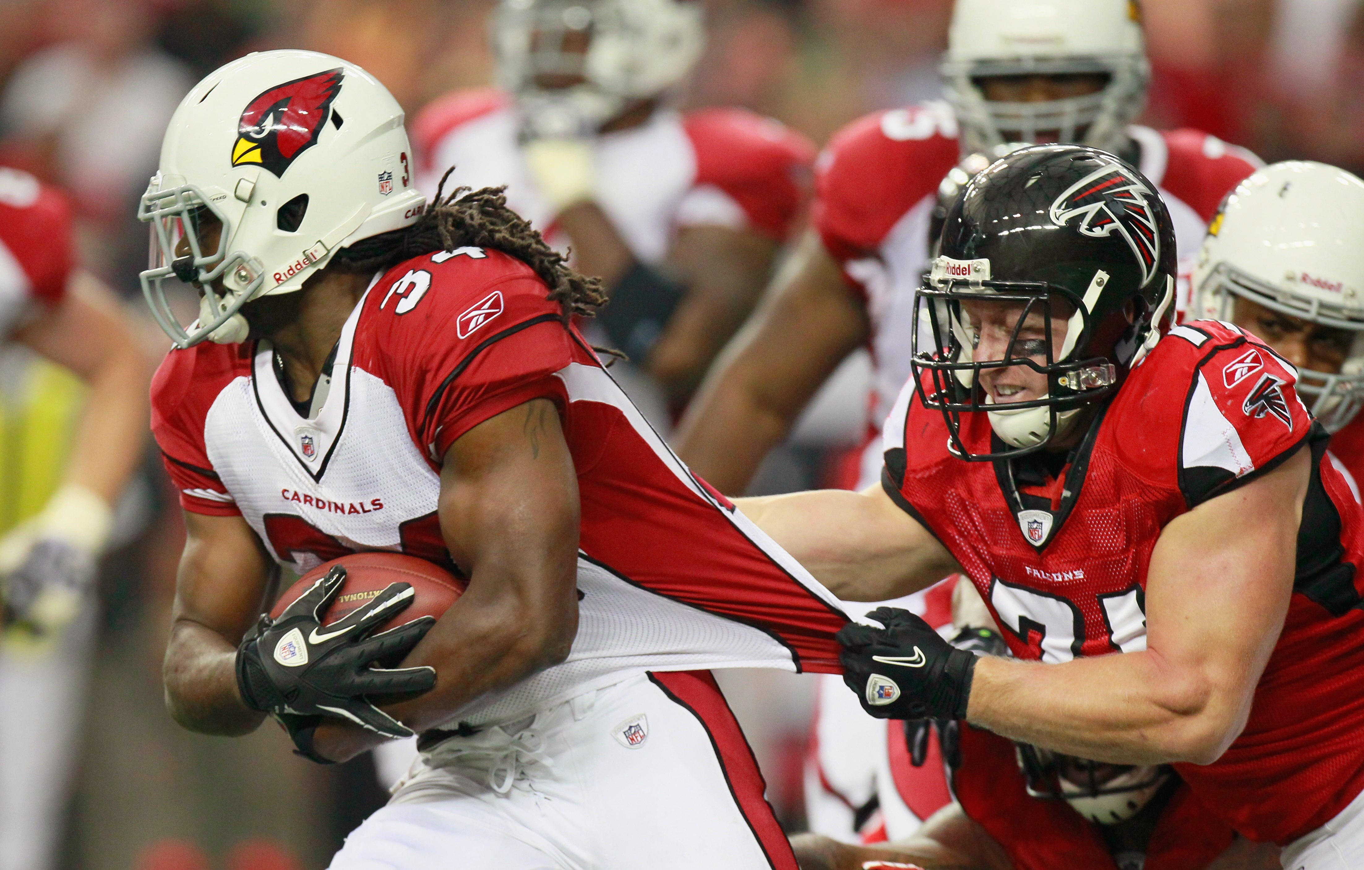 ATLANTA - SEPTEMBER 19:  Tim Hightower #34 of the Arizona Cardinals is tackled by Kroy Biermann #71 of the Atlanta Falcons at Georgia Dome on September 19, 2010 in Atlanta, Georgia.  (Photo by Kevin C. Cox/Getty Images)