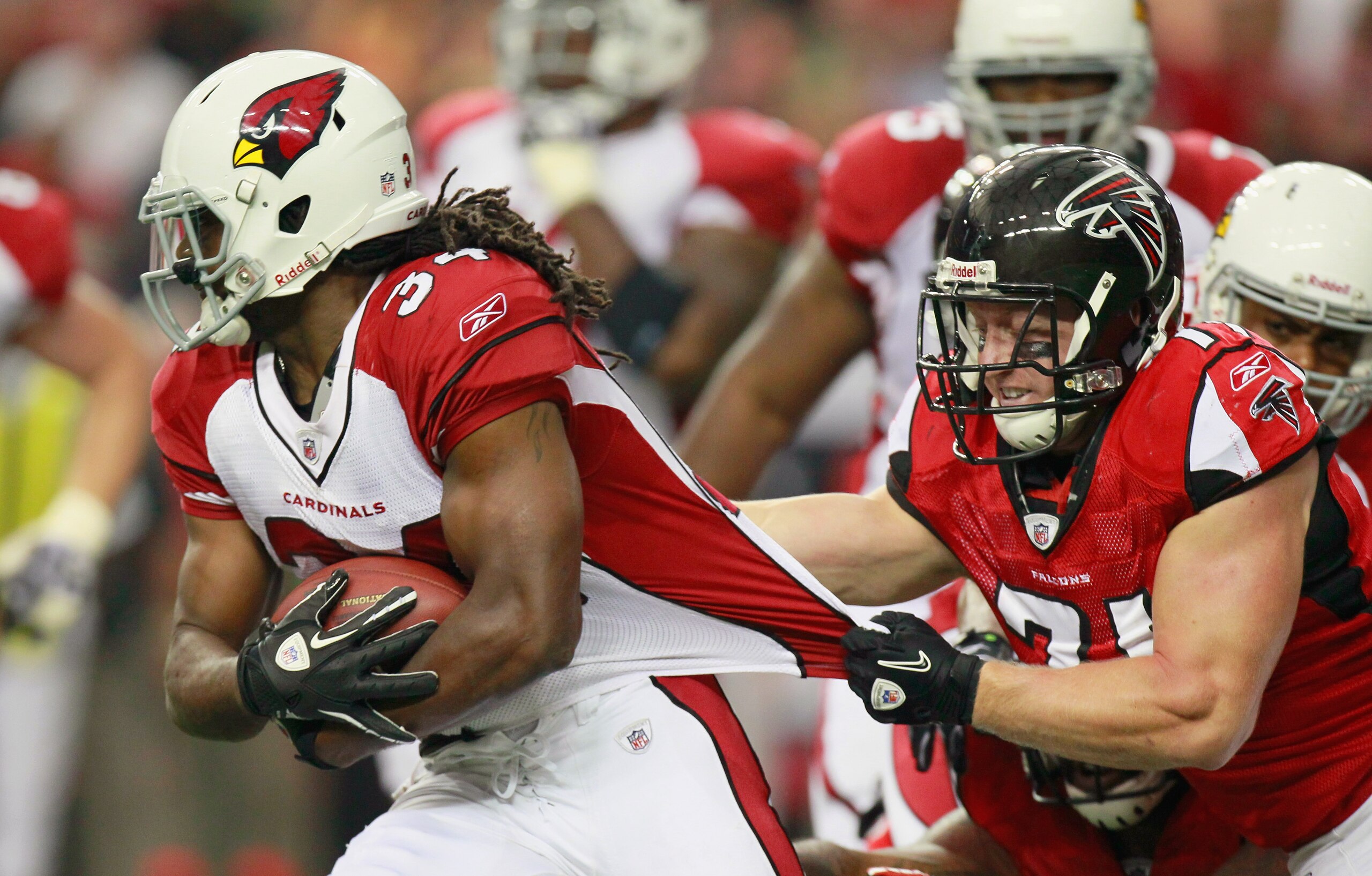 ATLANTA - SEPTEMBER 19: Tim Hightower #34 of the Arizona Cardinals is tackled by Kroy Biermann #71 of the Atlanta Falcons at Georgia Dome on September 19, 2010 in Atlanta, Georgia. (Photo by Kevin C. Cox/Getty Images) ATLANTA - SEPTEMBER 19: Tim Hightower #34 of the Arizona Cardinals is tackled by Kroy Biermann #71 of the Atlanta Falcons at Georgia Dome on September 19, 2010 in Atlanta, Georgia. (Photo by Kevin C. Cox/Getty Images)