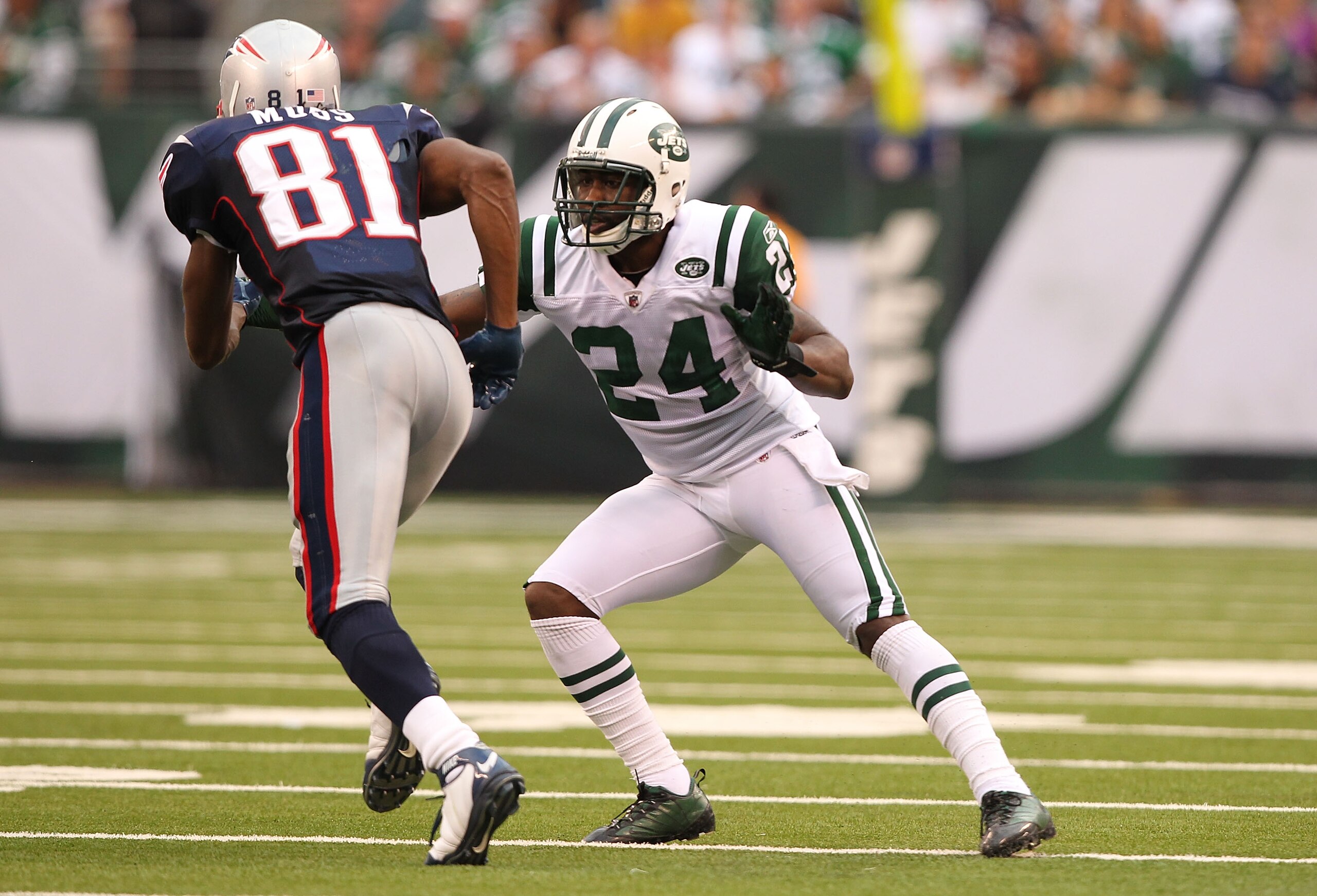 EAST RUTHERFORD, NJ - SEPTEMBER 19:  Darrelle Revis #24 of the New York Jets defends against Randy Moss #81 of the New England Patriots during their  game on September 19, 2010 at the New Meadowlands Stadium  in East Rutherford, New Jersey.  (Photo by Al 