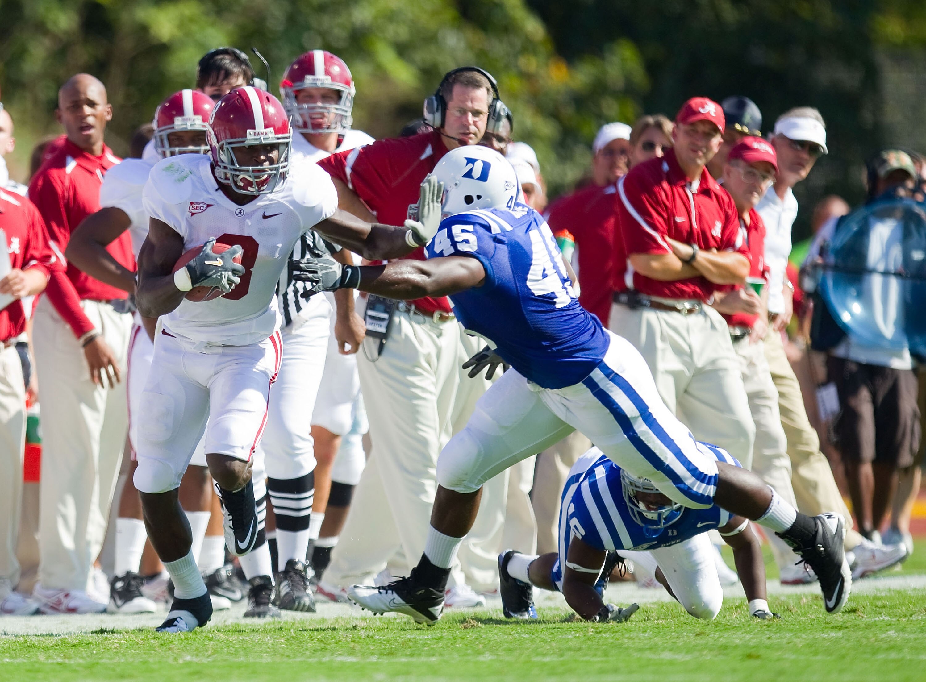 DURHAM, NC - SEPTEMBER 18: Julio Jones #8 of the Alabama Crimson Tide gives a stiff arm to Austin Gamble #45 of the Duke Blue Devils at Wallace Wade Stadium on September 18, 2010 in Durham, North Carolina.  The Crimson Tide defeated the Blue Devils 62-13.