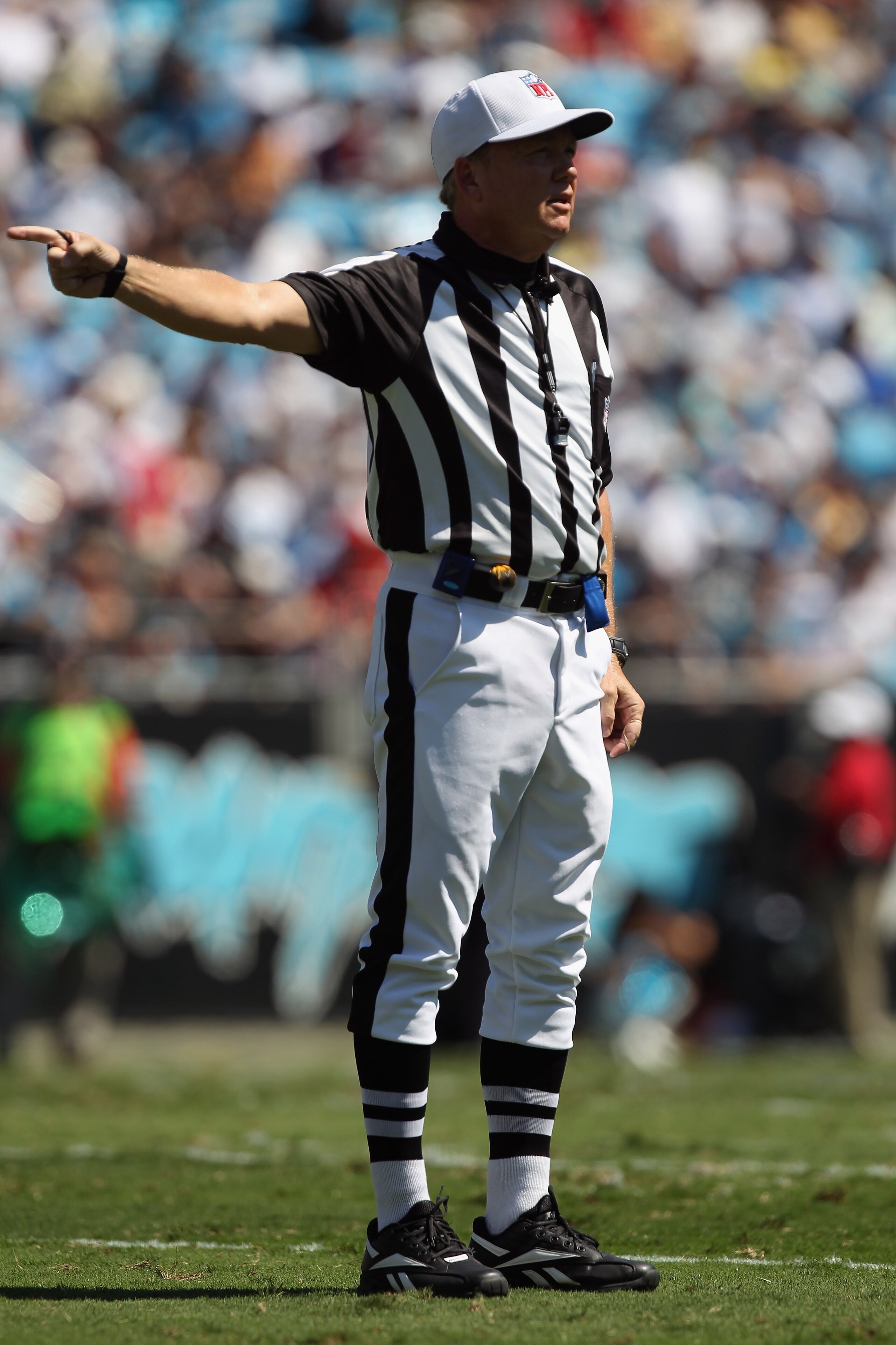 CHARLOTTE, NC - SEPTEMBER 19:  A referee makes a call at the Tampa Bay Buccaneers versus Carolina Panthers during their game at Bank of America Stadium on September 19, 2010 in Charlotte, North Carolina.  (Photo by Streeter Lecka/Getty Images)