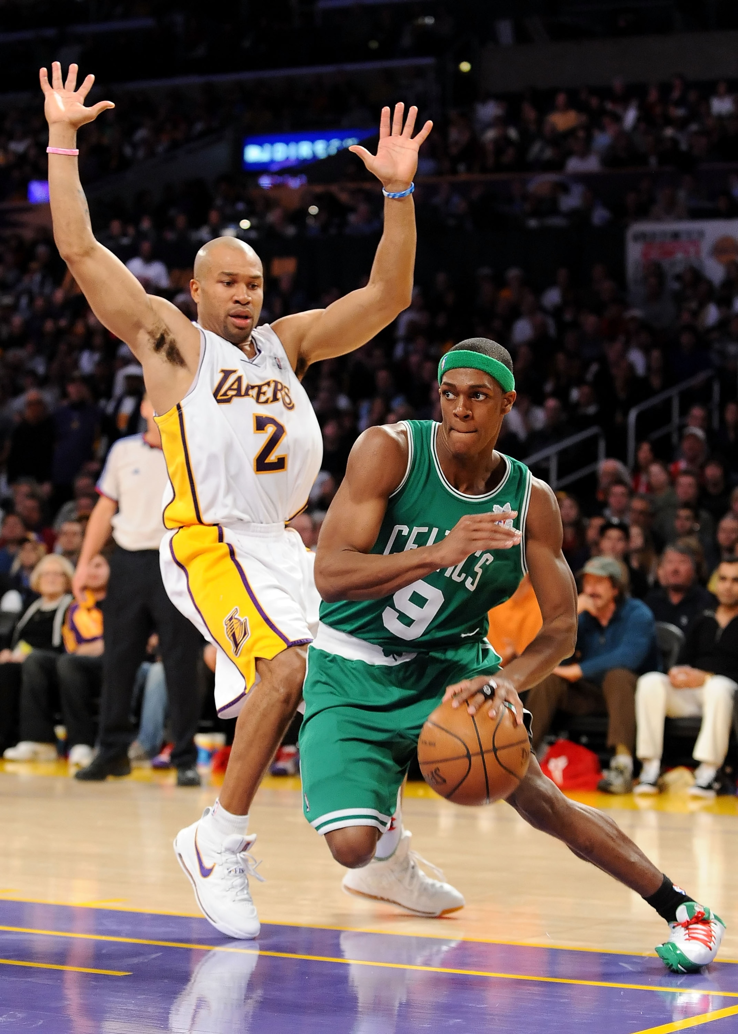 LOS ANGELES, CA - DECEMBER 25: Rajon Rondo #9 of the Boston Celtics drives to the basket against Derek Fisher #2 of the Los Angeles Lakers at Staples Center on December 25, 2008 in Los Angeles, California. The Lakers defeated the Celtics 92-83. NOTE T LOS ANGELES, CA - DECEMBER 25: Rajon Rondo #9 of the Boston Celtics drives to the basket against Derek Fisher #2 of the Los Angeles Lakers at Staples Center on December 25, 2008 in Los Angeles, California. The Lakers defeated the Celtics 92-83. NOTE T