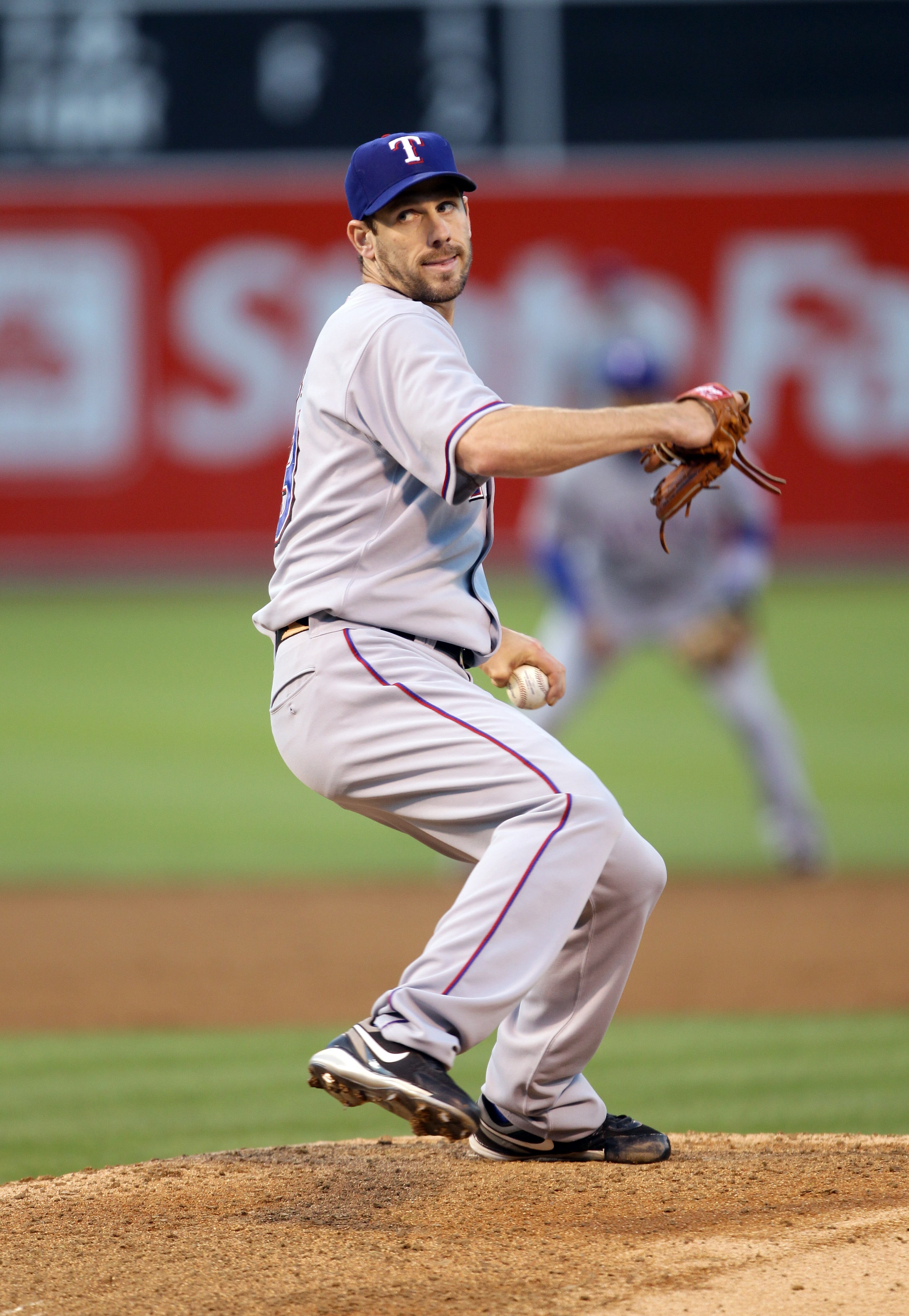OAKLAND, CA - AUGUST 06:  Cliff Lee #33 of the Texas Rangers pitches against the Oakland Athletics at the Oakland-Alameda County Coliseum on August 6, 2010 in Oakland, California.  (Photo by Ezra Shaw/Getty Images)