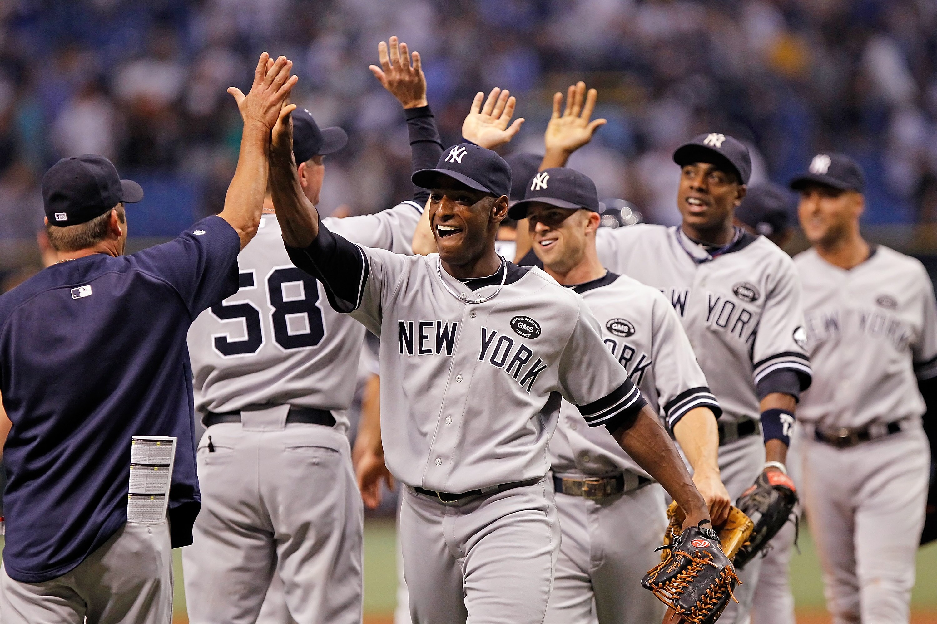 ST. PETERSBURG - SEPTEMBER 14:  Outfielder Greg Golson #27 of the New York Yankees celebrates his team's victory over the Tampa Bay Rays at Tropicana Field on September 14, 2010 in St. Petersburg, Florida.  (Photo by J. Meric/Getty Images)