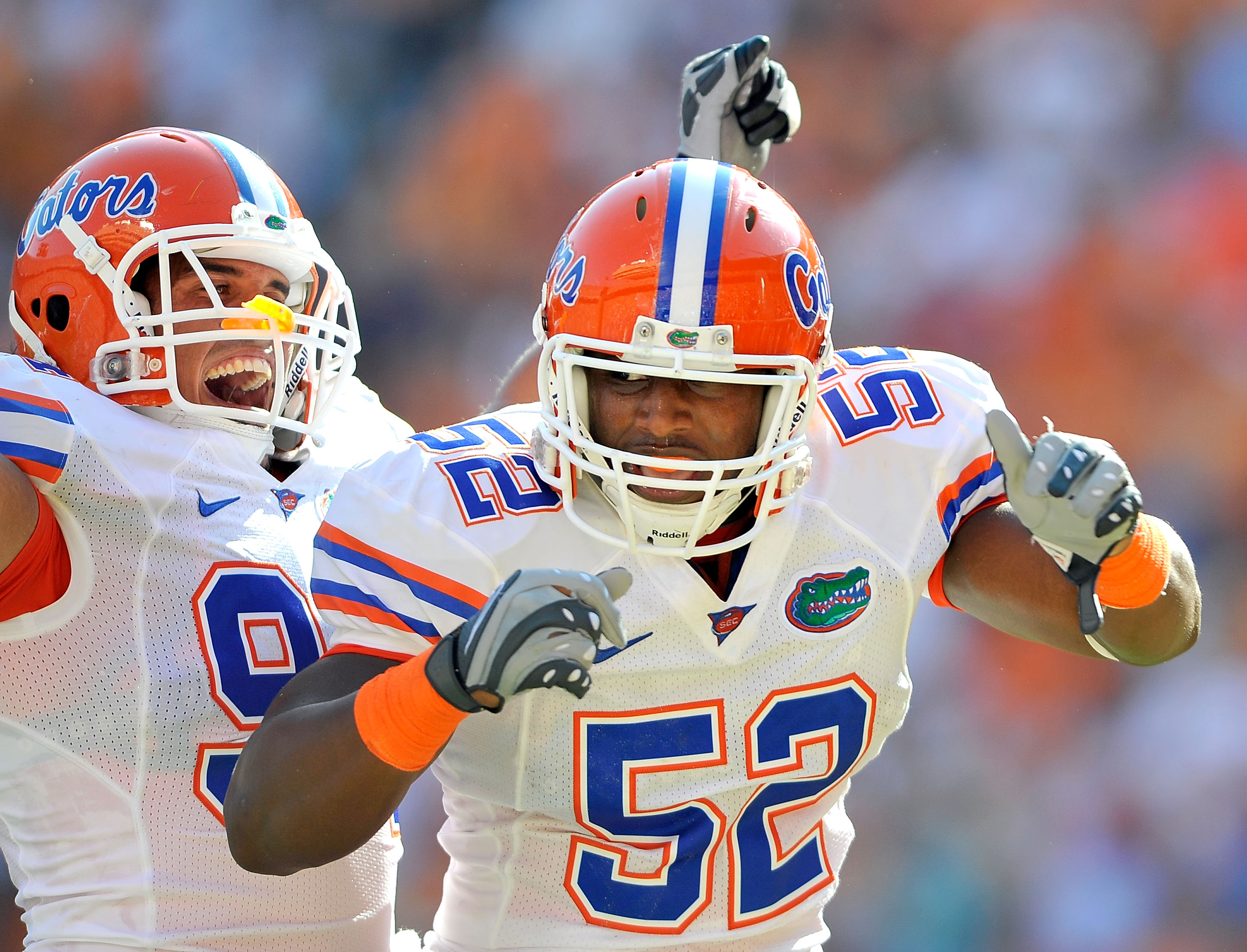 KNOXVILLE, TN - SEPTEMBER 18:  Jonathan Bostic #52 of the Florida Gators celebrates with teammate Justin Trattou #94 after intercepting a pass by quarterback Matt Simms #2 of the Tennessee Volunteers in the end zone during the first half at Neyland Stadiu