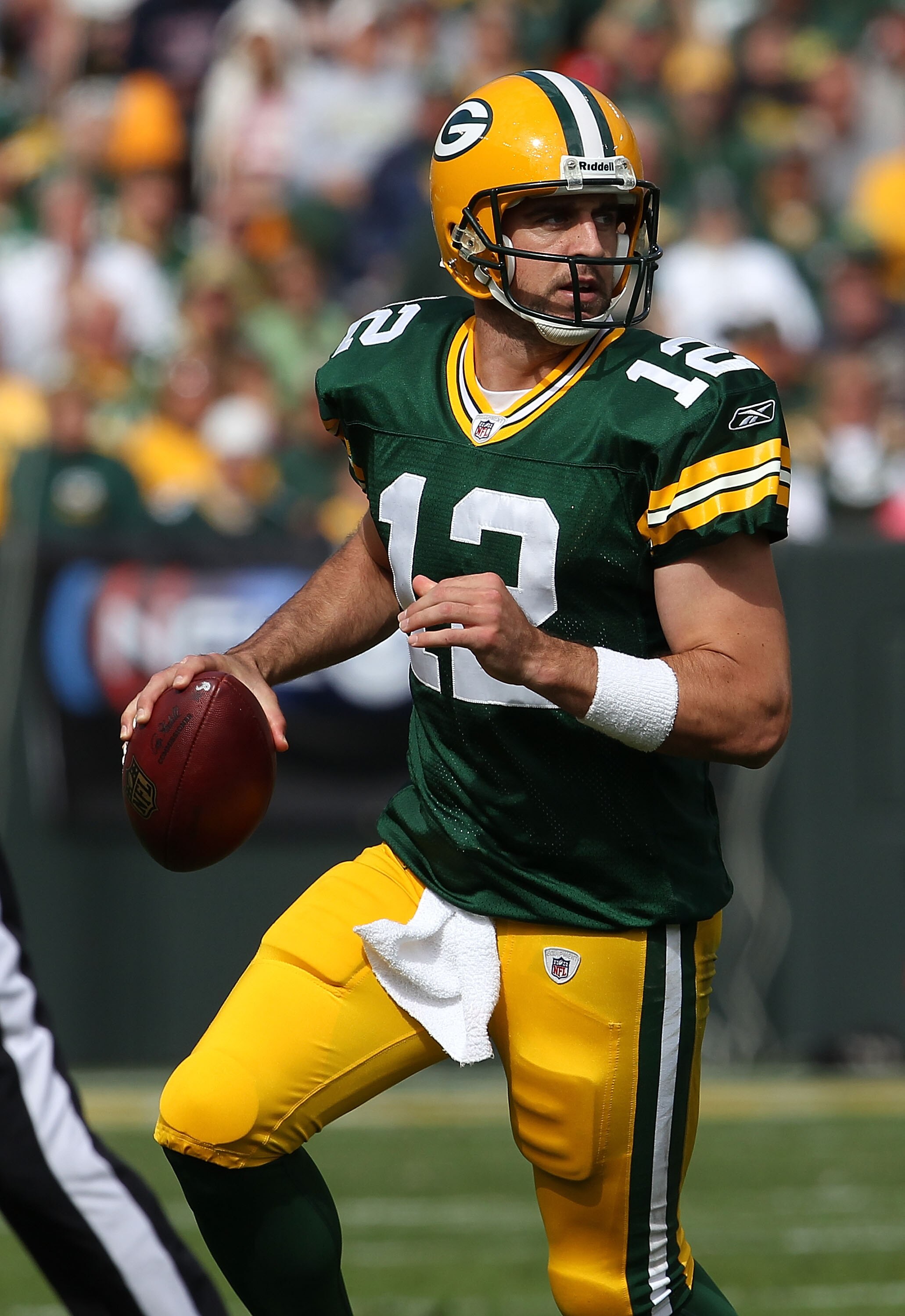 GREEN BAY, WI - SEPTEMBER 19: Aaron Rodgers #12 of the Green Bay Packers looks for a receiver against the Buffalo Bills at Lambeau Field on September 19, 2010 in Green Bay, Wisconsin. The Packers defeated the Bills 34-7. (Photo by Jonathan Daniel/Getty Im