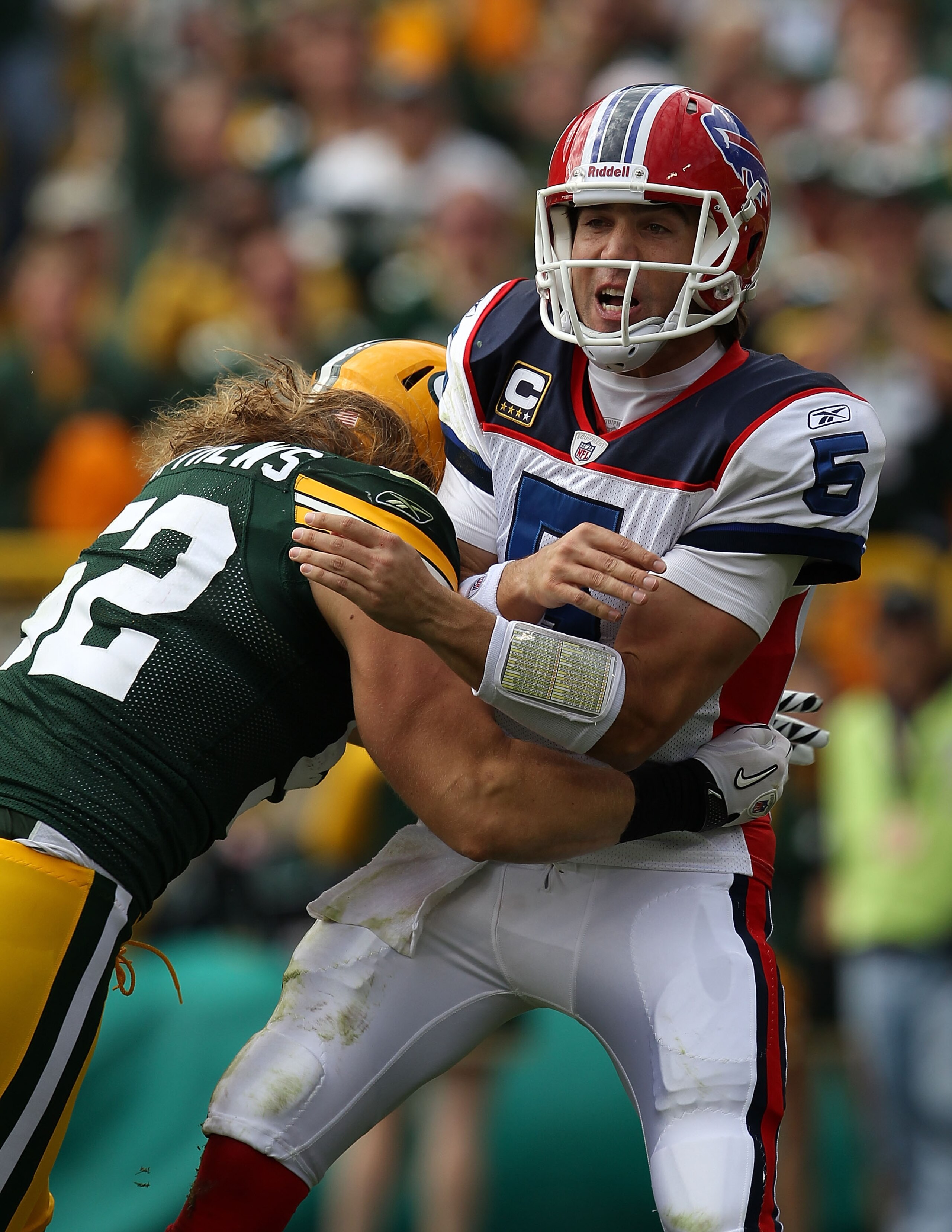 GREEN BAY, WI - SEPTEMBER 19: Clay Matthews #52 of the Green Bay Packers hits Trent Edwards #5 of the Buffalo Bills after Edwards passes at Lambeau Field on September 19, 2010 in Green Bay, Wisconsin. The Packers defeated the Bills 34-7. (Photo by Jonatha