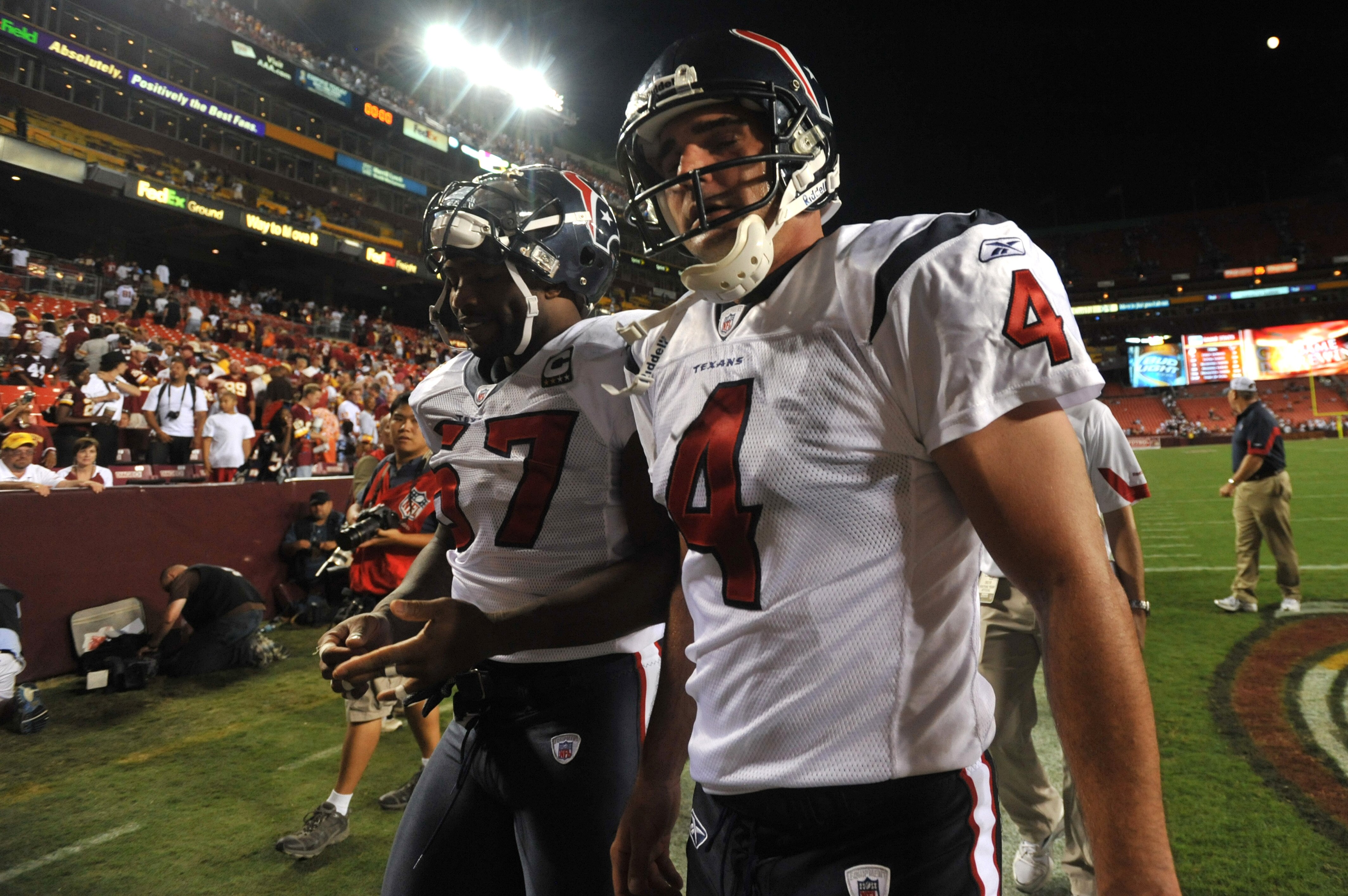 LANDOVER - SEPTEMBER 19:  Neil Rackers #4 of the Houston Texans walks off the field after kicking the winning field goal against the Washington Redskins at FedExField on September 19, 2010 in Landover, Maryland. The Texans defeated the Redskins 30-27 in o
