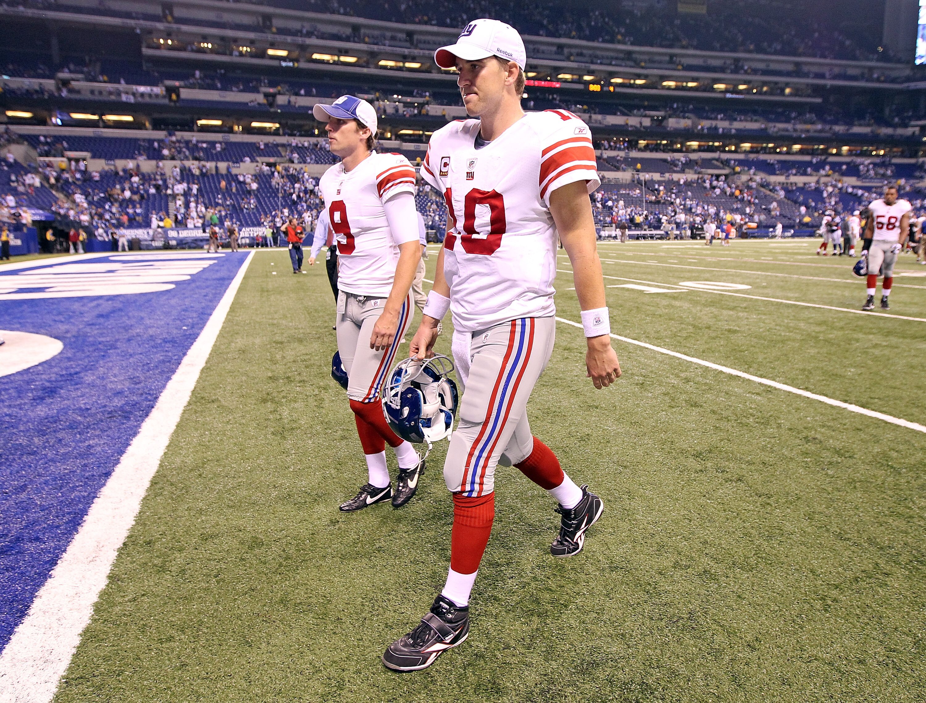 INDIANAPOLIS - SEPTEMBER 19:  Eli Manning #10  of the New York Giants walks off of the field following the the Giants 38-14 loss to the Indianapolis Colts at Lucas Oil Stadium on September 19, 2010 in Indianapolis, Indiana.  (Photo by Andy Lyons/Getty Ima