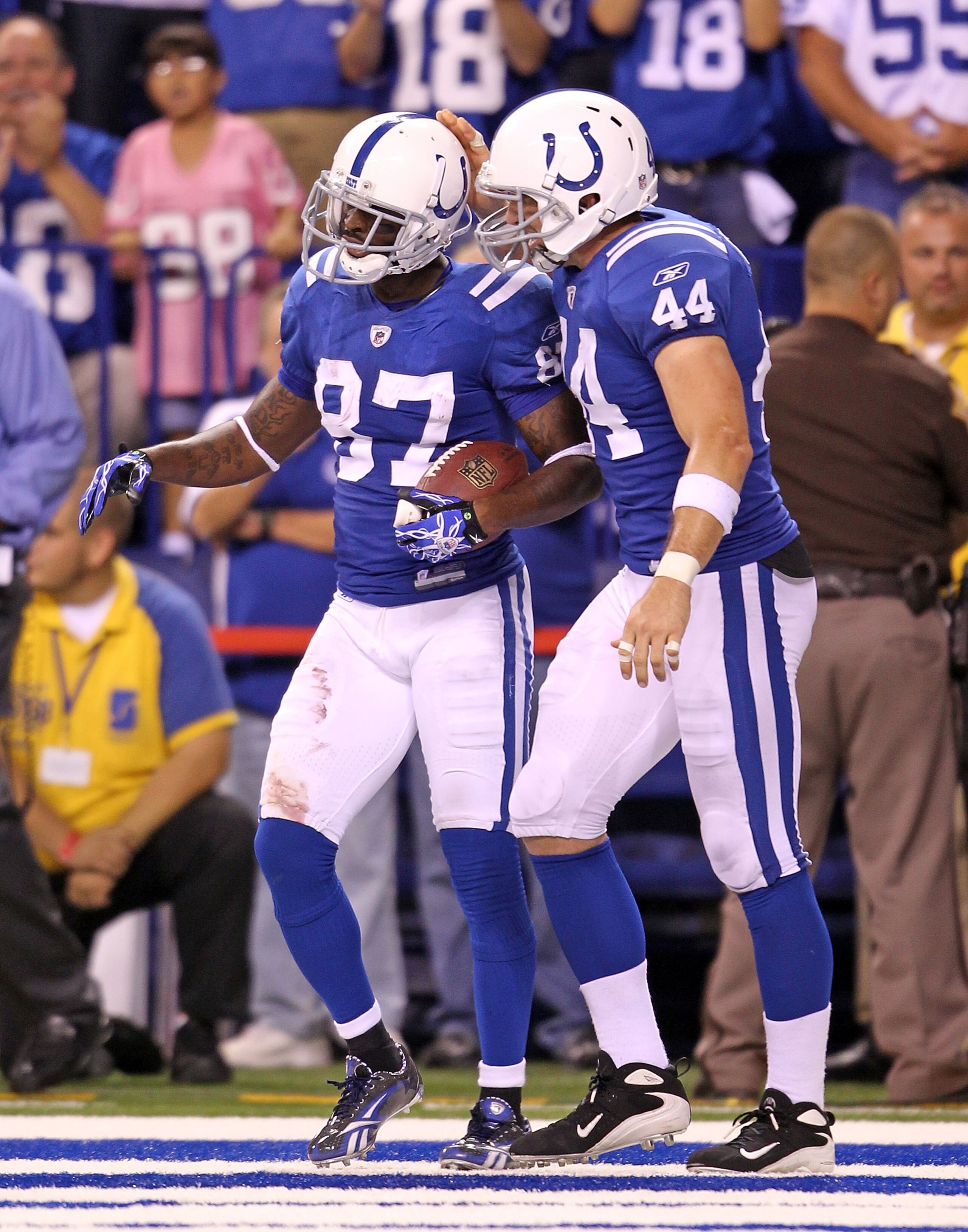 INDIANAPOLIS - SEPTEMBER 19:  Reggie Wayne #87 of the Indianapolis Colts celebrates with Dallas Clark #44 after Wayne caught a touchdown pass during the NFL game against the New York Giants  at Lucas Oil Stadium on September 19, 2010 in Indianapolis, Indi