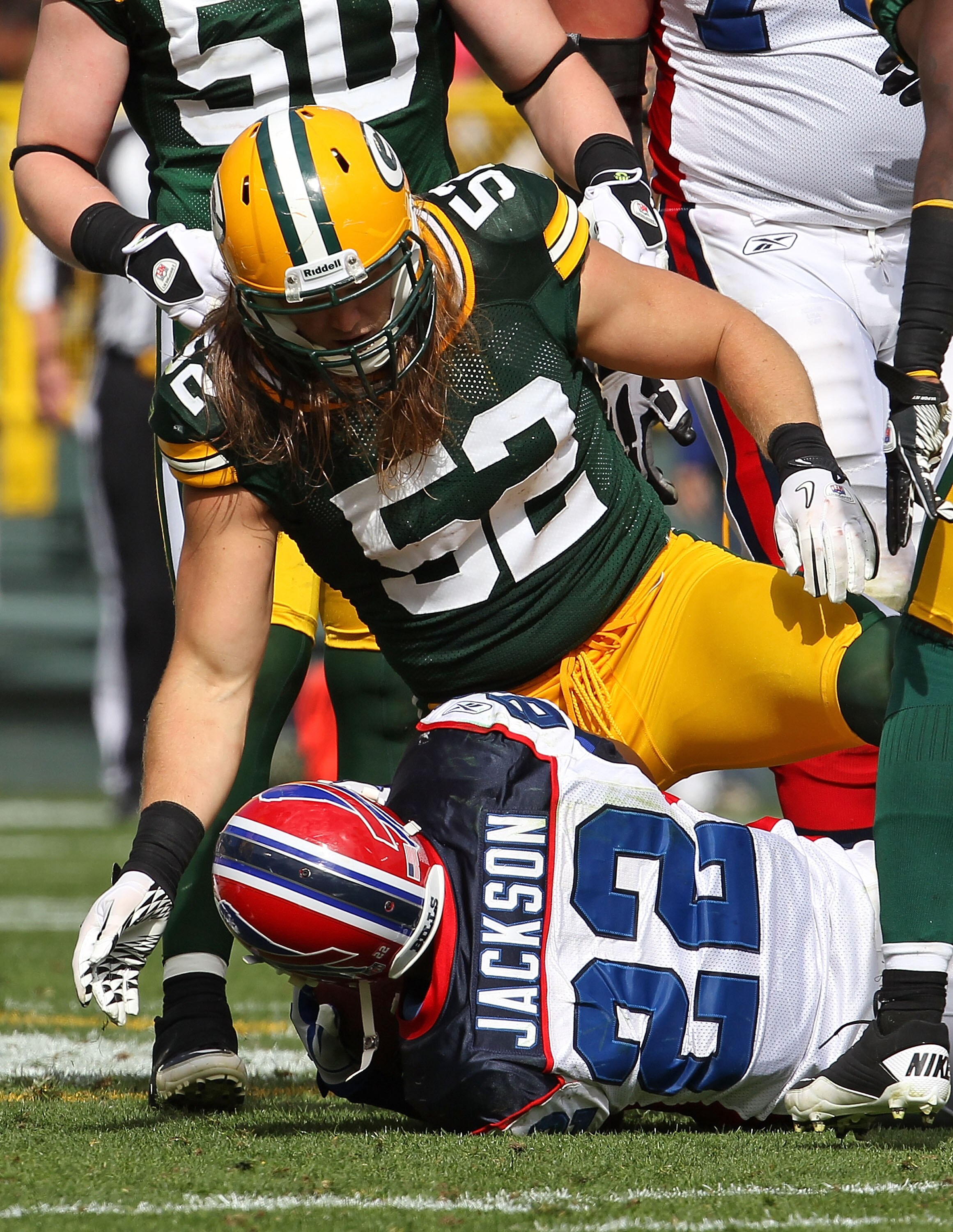GREEN BAY, WI - SEPTEMBER 19: Clay Matthews #52 of the Green Bay Packers looks at Fred Jackson #22 of the Buffalo Bills after a tackle at Lambeau Field on September 19, 2010 in Green Bay, Wisconsin. The Packers defeated the Bills 34-7.  (Photo by Jonathan