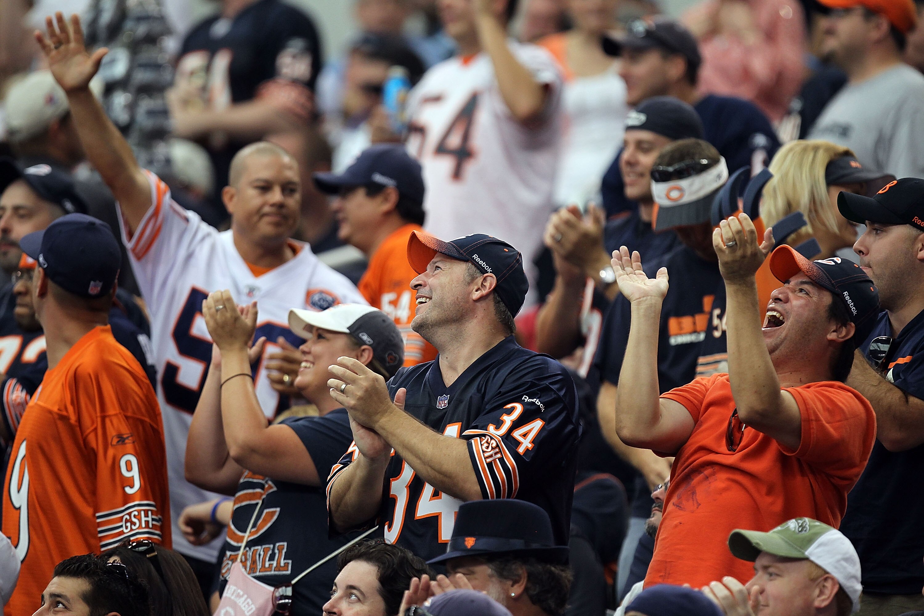 ARLINGTON, TX - SEPTEMBER 19:  Fans of the Chicago Bears cheer during play against the Dallas Cowboys at Cowboys Stadium on September 19, 2010 in Arlington, Texas.  (Photo by Ronald Martinez/Getty Images)