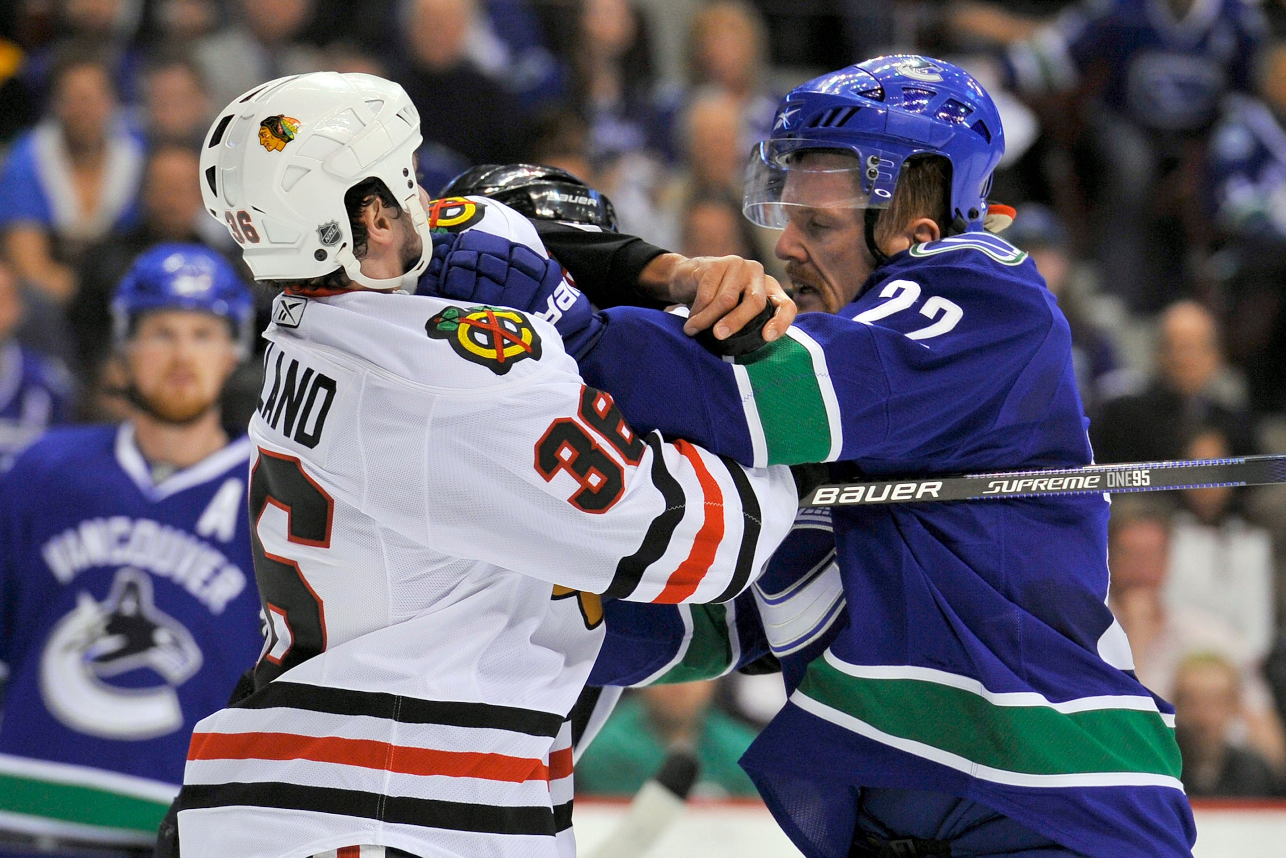 VANCOUVER, CANADA - MAY 5:  Daniel Sedin #22 of the Vancouver Canucks and Dave Bolland #36 of the Chicago Blackhawks tussle prior to a face-off during the first period in Game Three of the Western Conference Semifinals during the 2010 NHL Stanley Cup Play