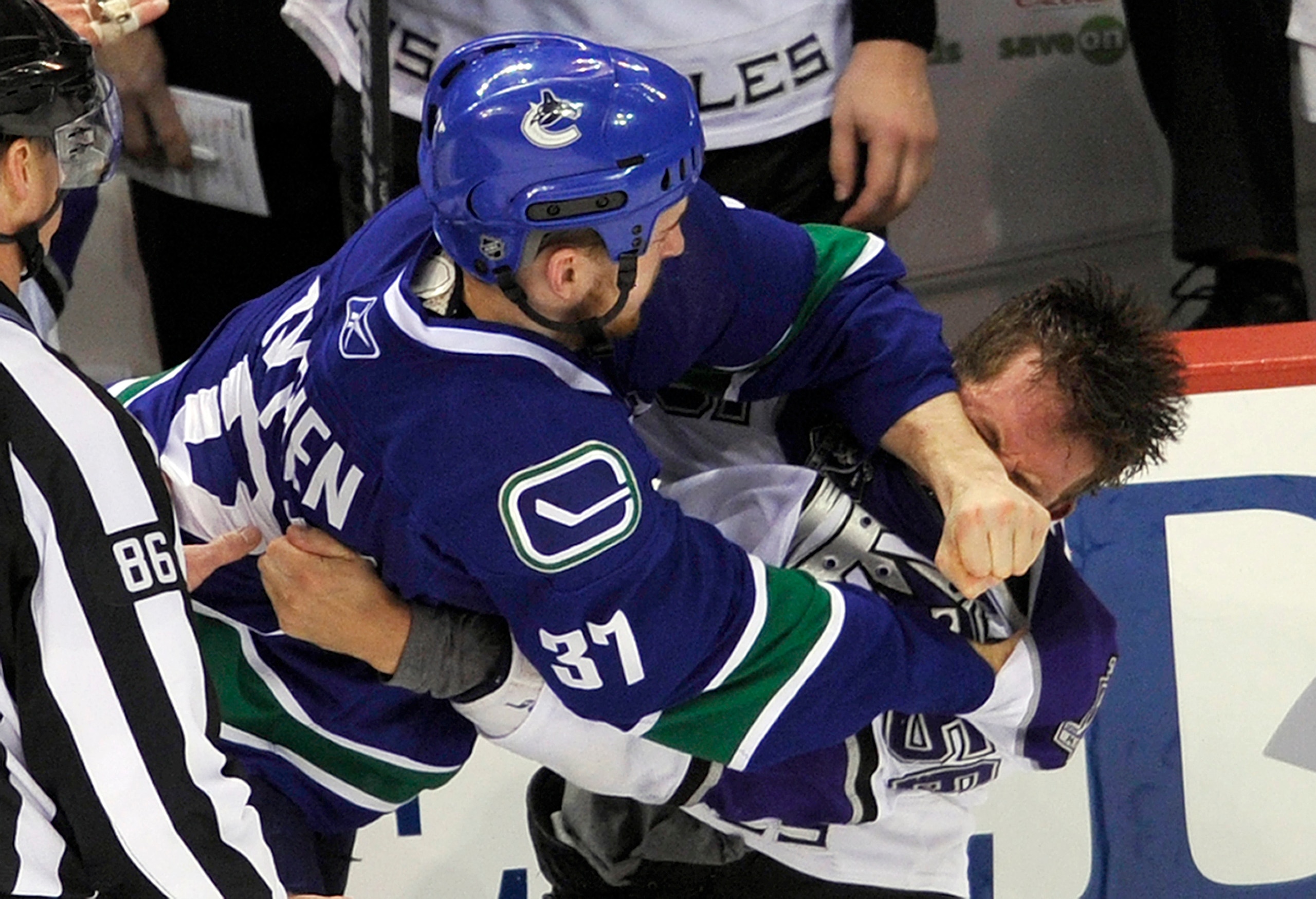 VANCOUVER, CANADA - APRIL 23:  Rick Rypien #37 of the Vancouver Canucks hits Richard Clune #56 of the Los Angeles Kings with a punch during a fight in the third period in Game Five of the Western Conference Quarterfinals during the 2010 NHL Stanley Cup Pl