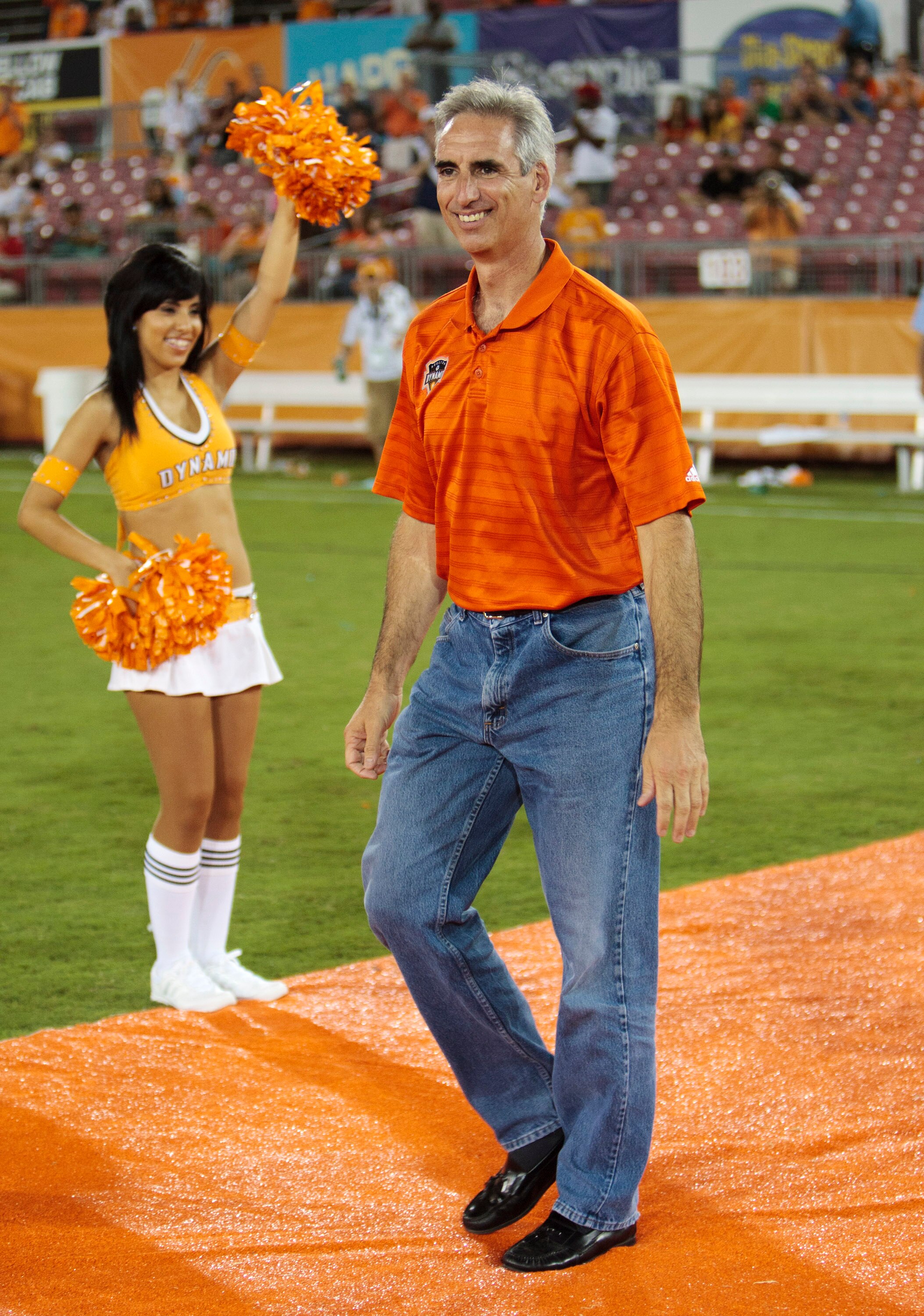 HOUSTON - JUNE 26:  Houston Dynamo President and General Manager Oliver Luck receives some gifts from the Dynamo's Chris Canetti after the game at Robertson Stadium on June 26, 2010 in Houston, Texas. Luck is leaving the Dynamo to take the athletic direct
