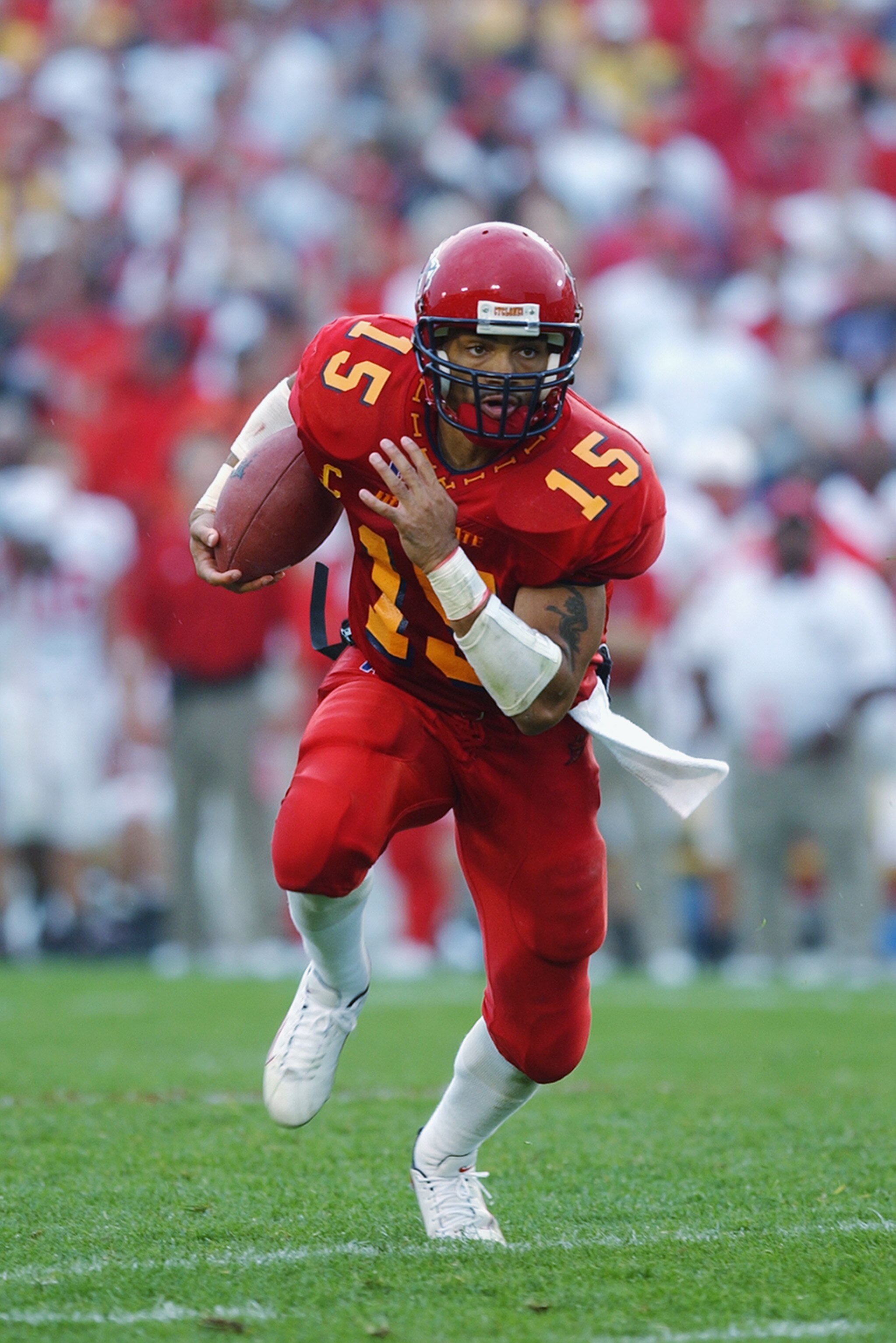 AMES, IOWA - SEPTEMBER 28:  Quarterback Seneca Wallace #15 of Iowa State races towards the endzone and scores against Nebraska on September 28, 2002 at Jack Trice Stadium in Ames, Iowa.  Iowa State defeated Nebraska 36-14.  (Photo by Matthew Stockman/Gett