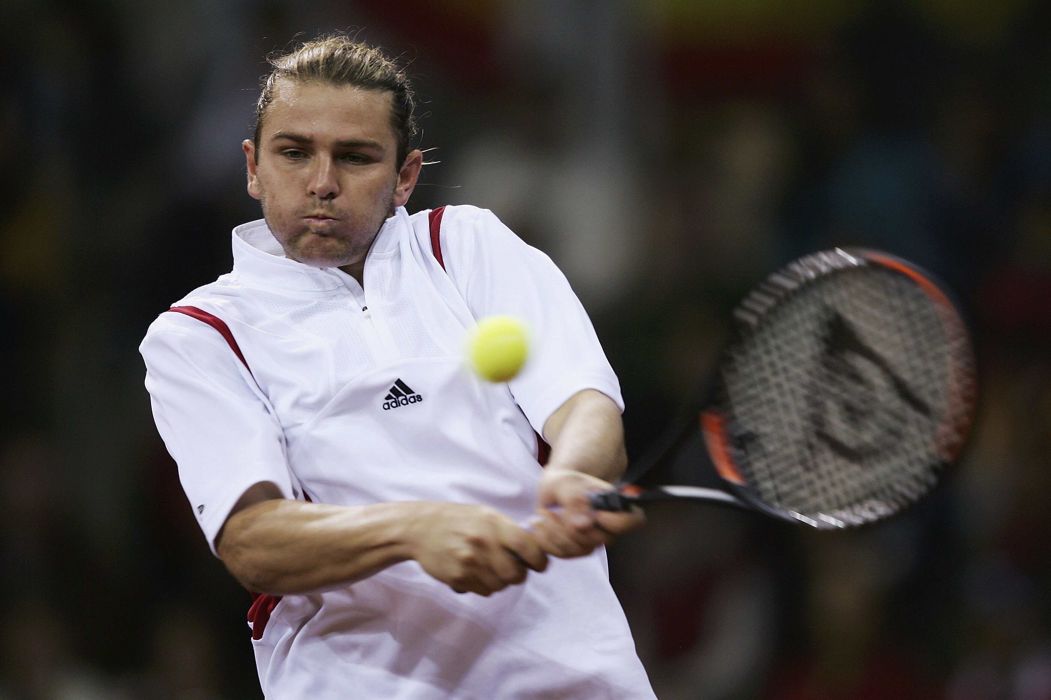 SEVILLE, SPAIN - DECEMBER 3:  Mardy Fish of the USA plays a backhand during his straight sets defeat by Carlos Moya of Spain in the first rubber during the Davis Cup by BNP Paribas-World Group Final between Spain and United States of America at the Estadi