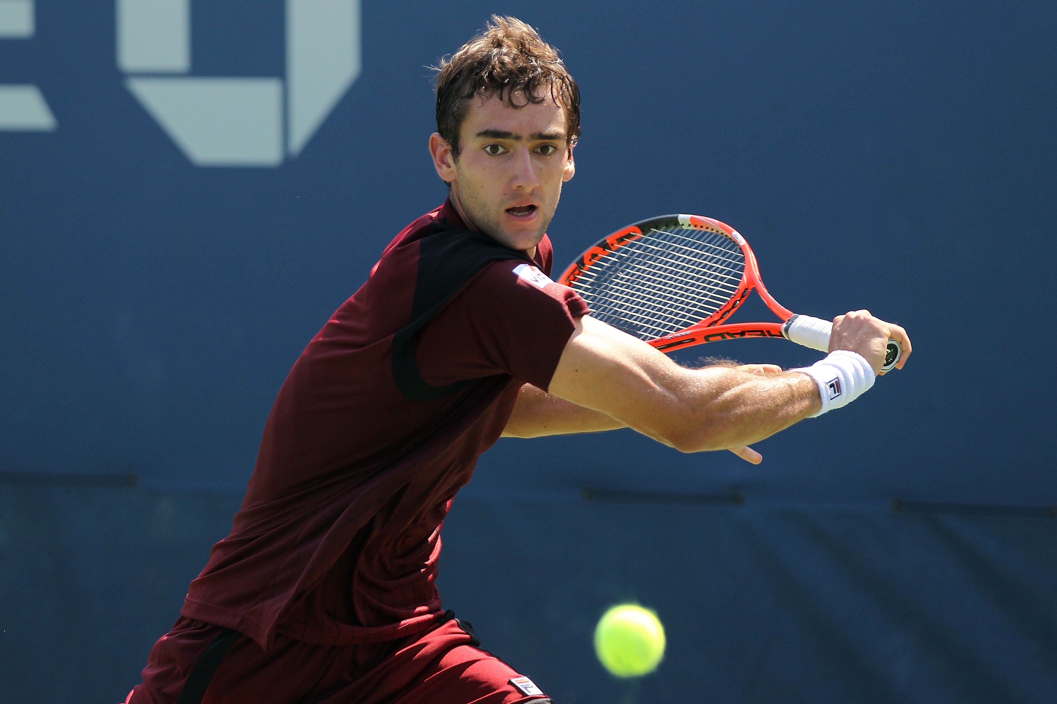 NEW YORK - SEPTEMBER 02:  Marin Cilic of Crotia hits a backhand return against Kei Nishikori of Japan during his men's singles match on day four of the 2010 U.S. Open at the USTA Billie Jean King National Tennis Center on September 2, 2010 in the Flushing