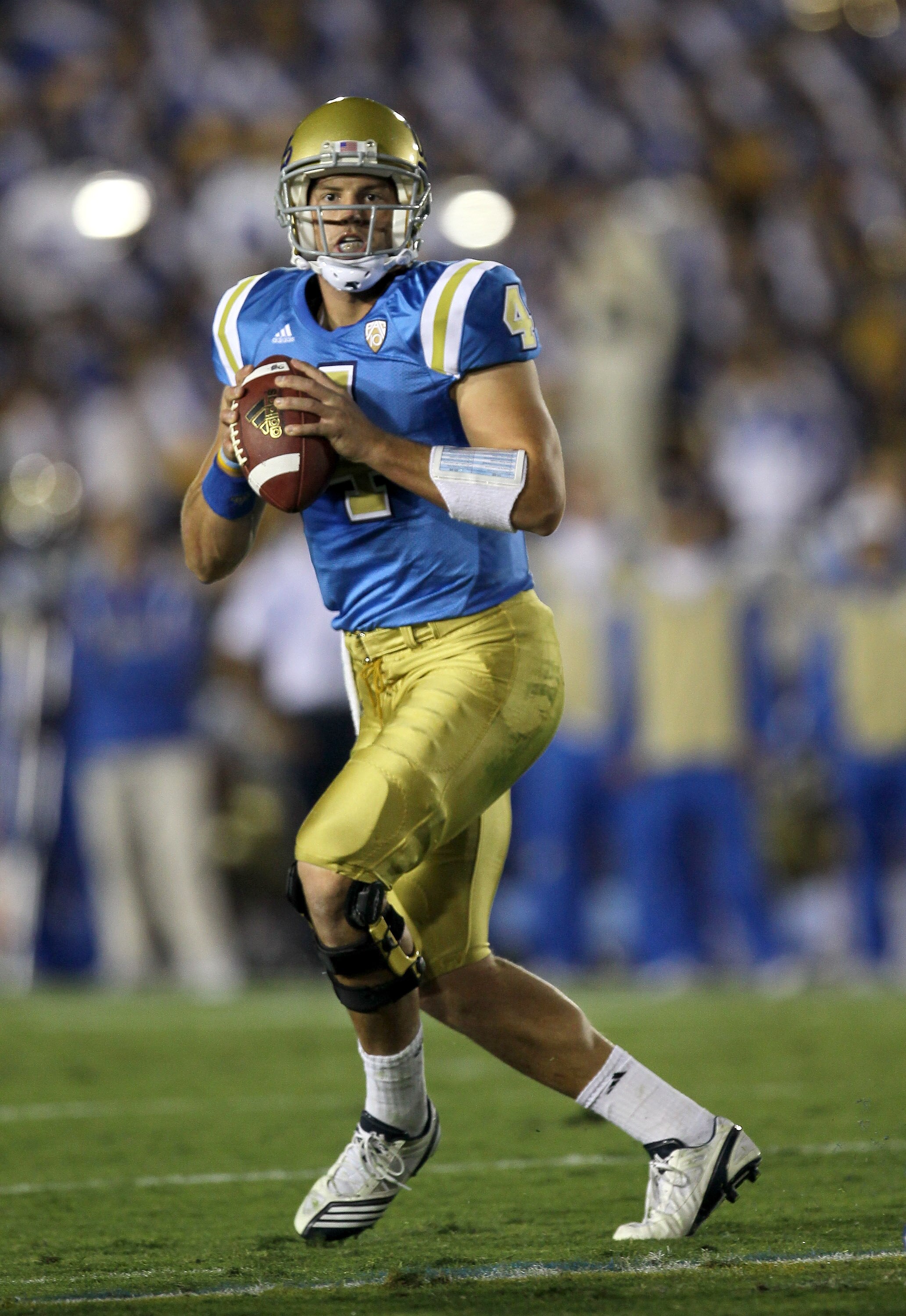 PASADENA, CA - SEPTEMBER 18:  Quarterback Kevin Prince #4 of the UCLA Bruins rolls out to throw a pass against the Houston Cougars at the Rose Bowl on September 18, 2010 in Pasadena, California.  (Photo by Stephen Dunn/Getty Images)