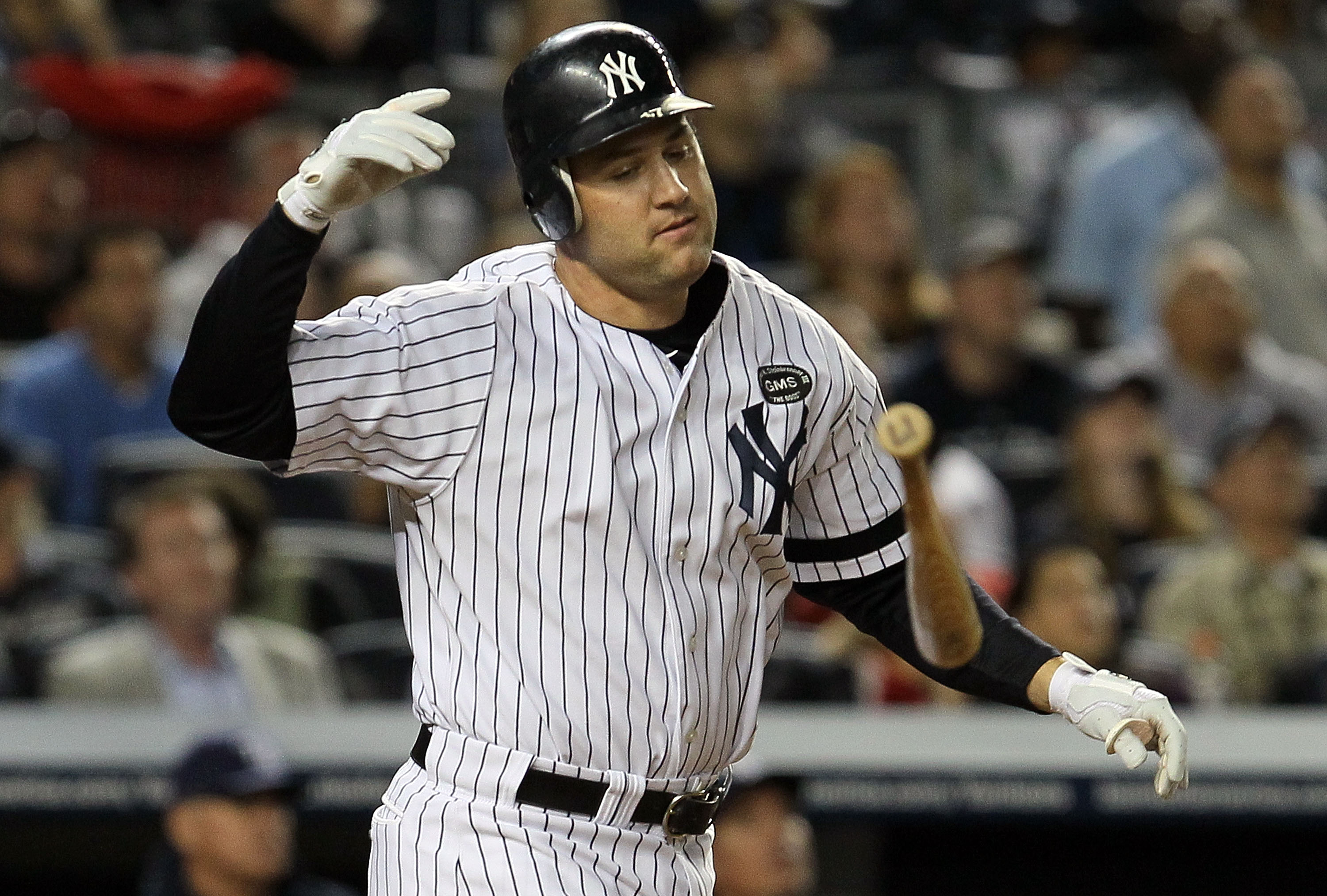 NEW YORK - SEPTEMBER 20:  Lance Berkman #17 of the New York Yankees tosses his bat after popping out with the bases loaded to end the fifth ining against the Tampa Bay Rays on September 20, 2010 at Yankee Stadium in the Bronx borough of New York City.  (P