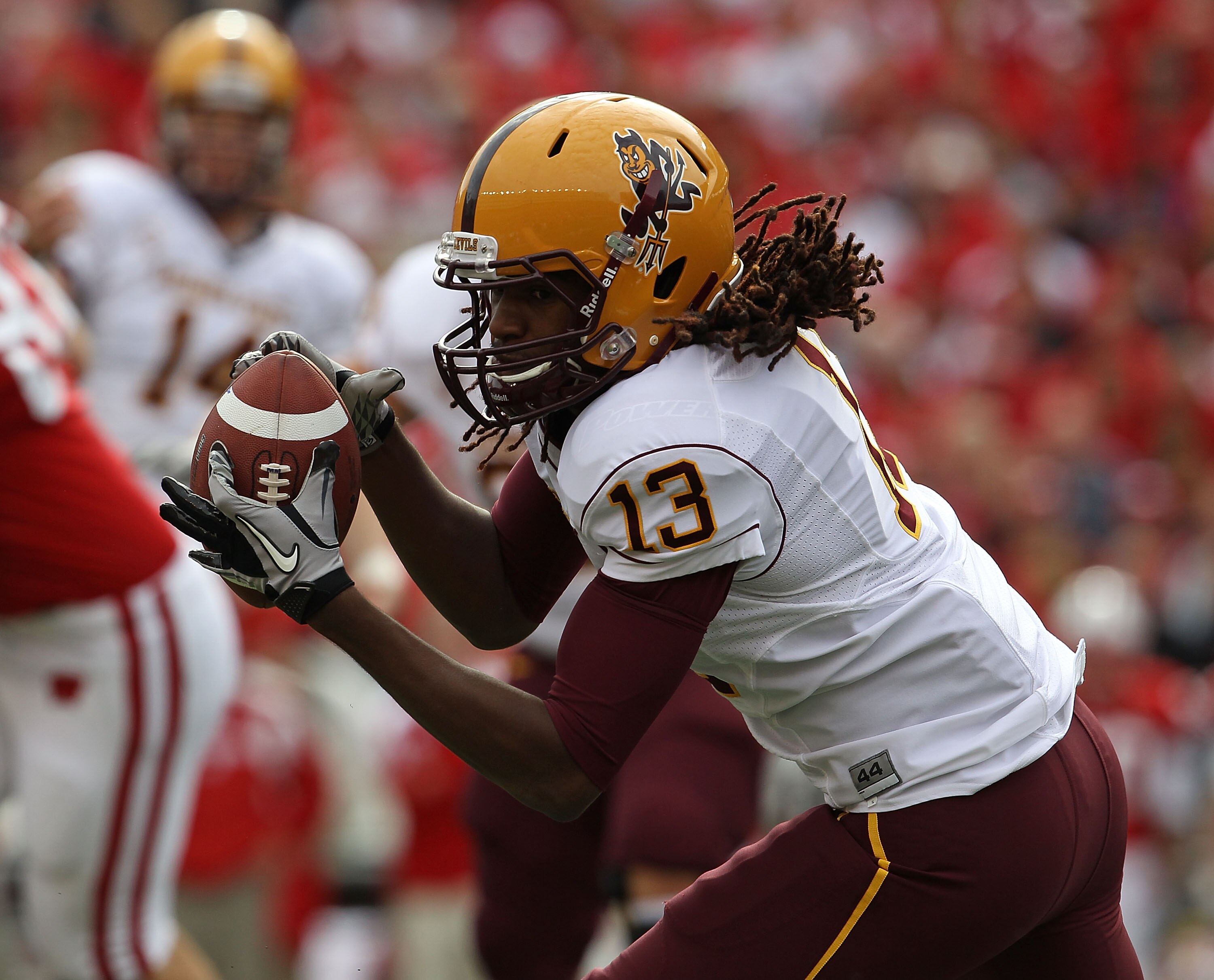 MADISON, WI - SEPTEMBER 18: Geroge Bell #13 of the Arizona State Sun Devils catches a pass for a first down against the Wisconsin Badgers at Camp Randall Stadium on September 18, 2010 in Madison, Wisconsin. (Photo by Jonathan Daniel/Getty Images)
