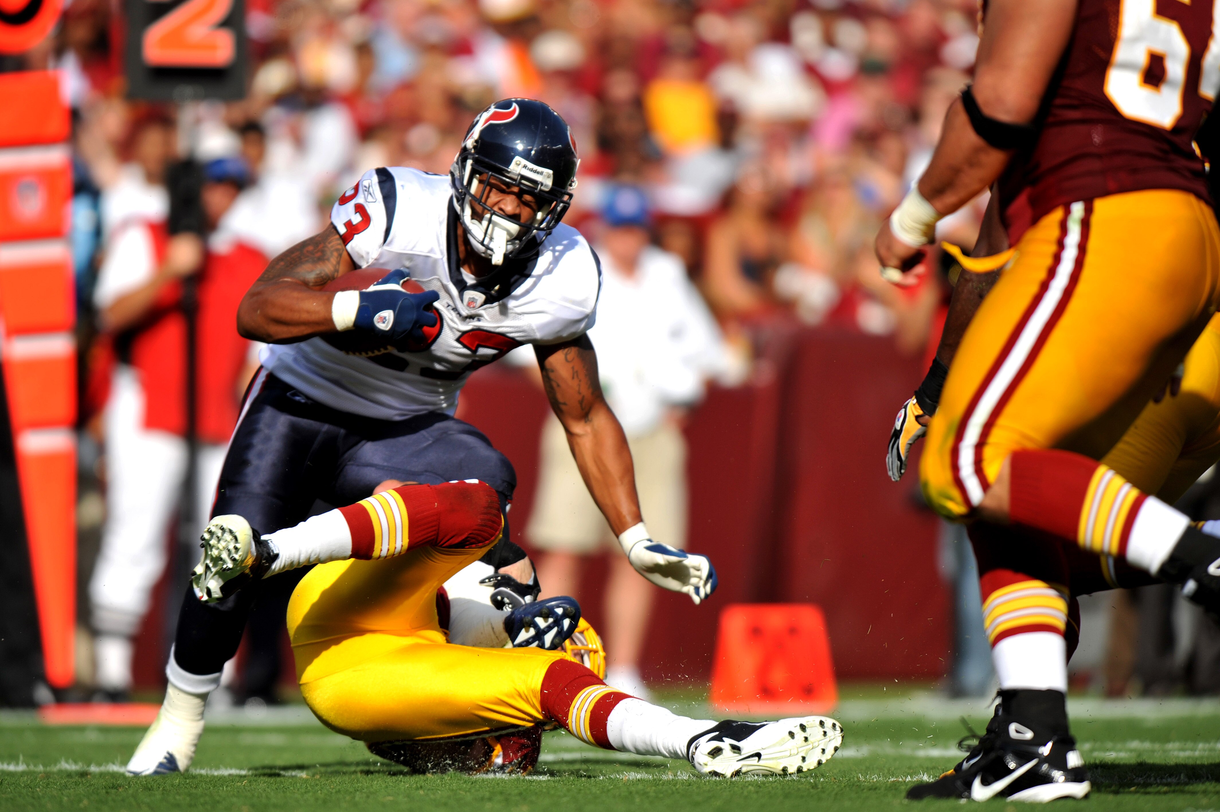 LANDOVER - SEPTEMBER 19:  Arian Foster #23 of the Houston Texans runs the ball against the Washington Redskins at FedExField on September 19, 2010 in Landover, Maryland. The Texans defeated the Redskins 30-27 in overtime. (Photo by Larry French/Getty Imag