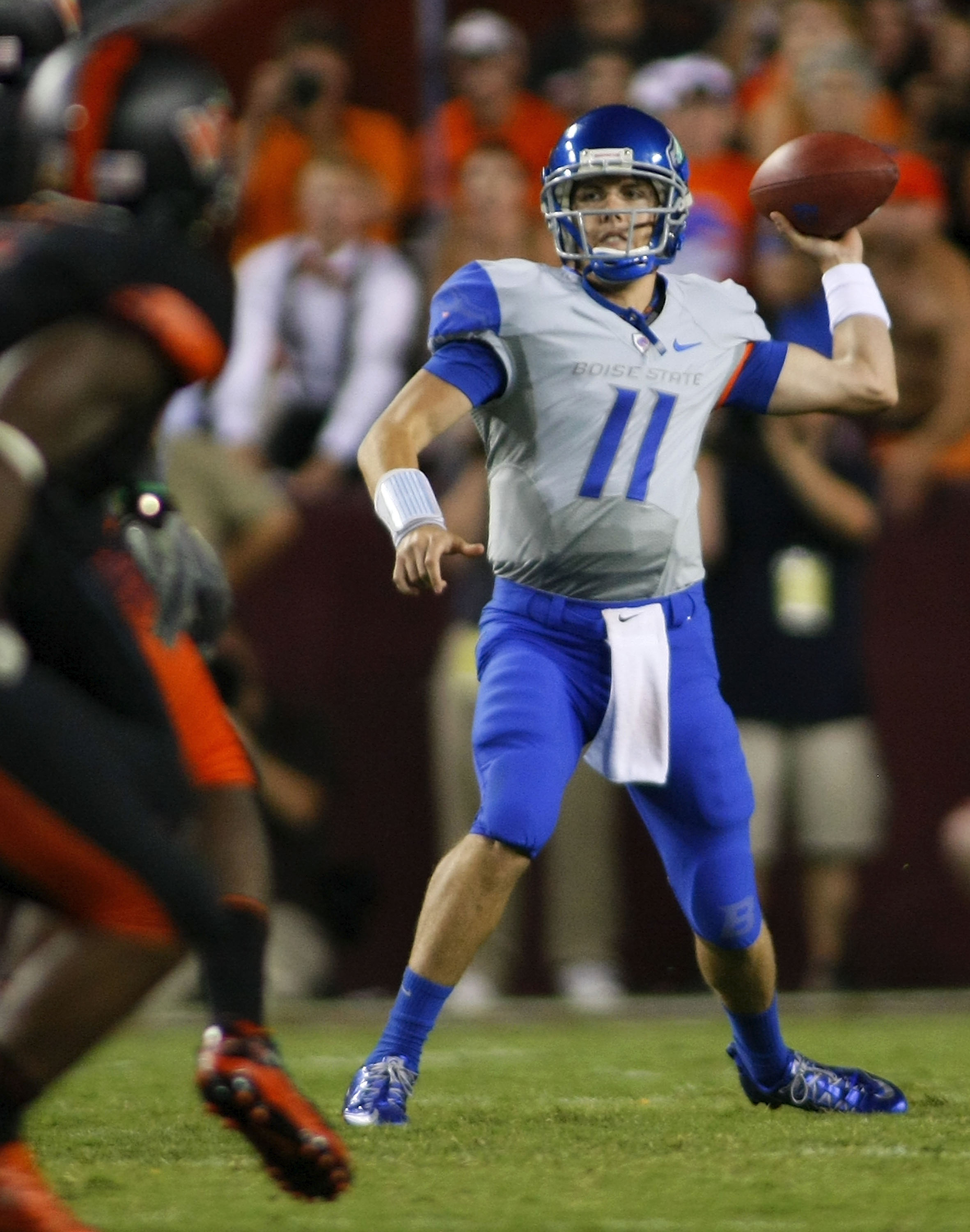 LANDOVER, MD - SEPTEMBER 06:  Quarterback Kellen Moore #11 of the Boise State Broncos passes against the Virginia Tech Hokies at FedExField on September 6, 2010 in Landover, Maryland.  (Photo by Geoff Burke/Getty Images)
