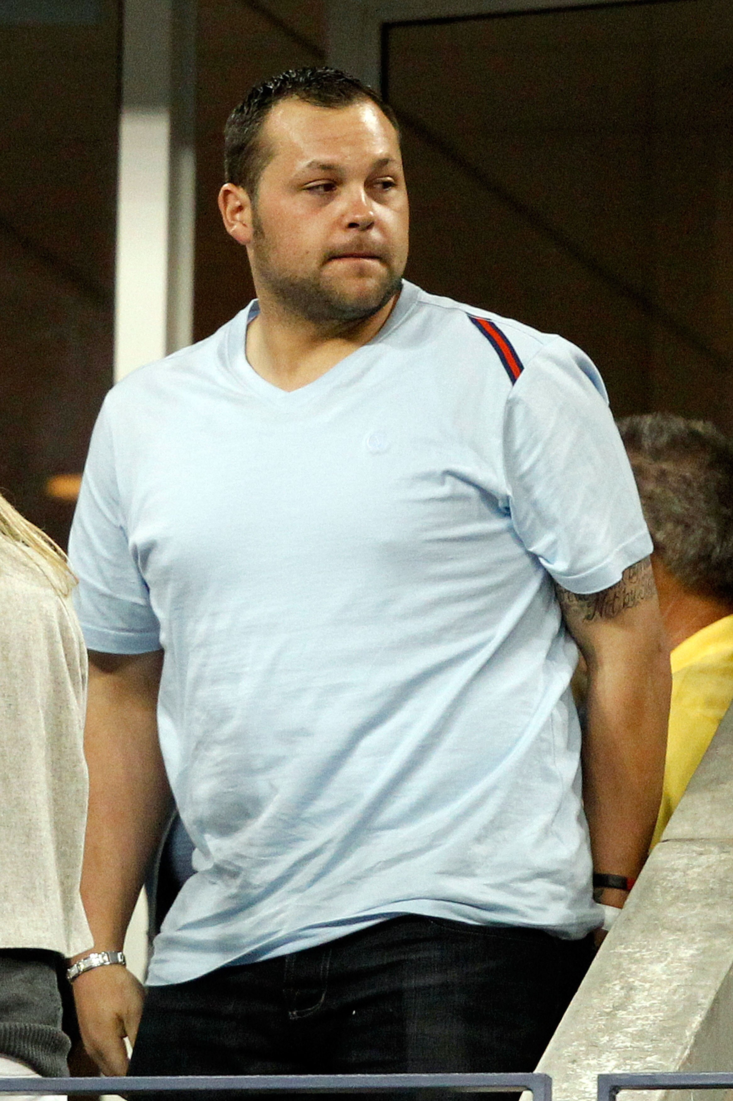NEW YORK - SEPTEMBER 08:  Joba Chamberlain looks on as Robin Soderling of Sweden plays against Roger Federer of Switzerland during their men's singles quarterfinal match on day ten of the 2010 U.S. Open at the USTA Billie Jean King National Tennis Center 