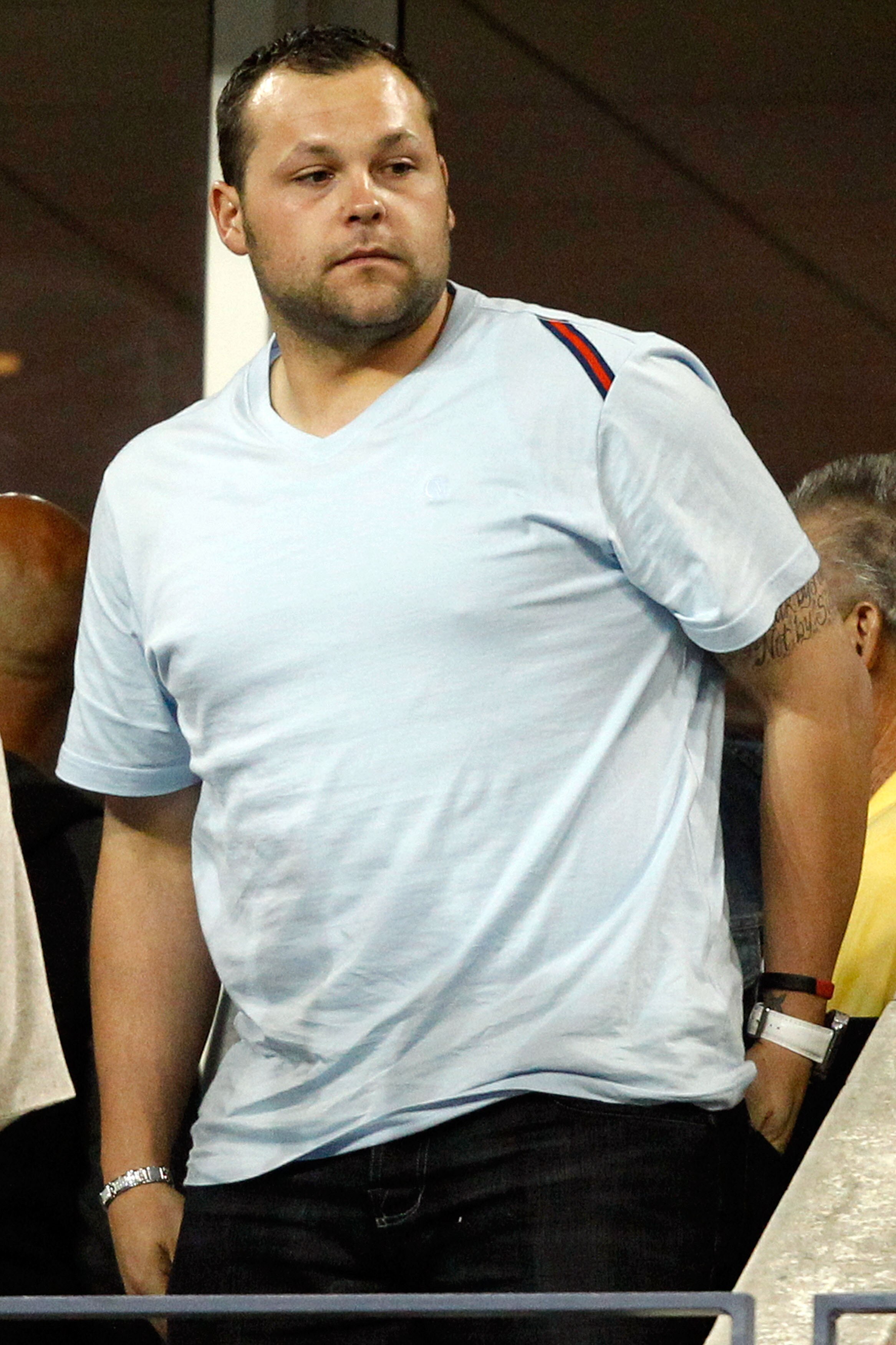 NEW YORK - SEPTEMBER 08:  Joba Chamberlain looks on as Robin Soderling of Sweden plays against Roger Federer of Switzerland during their men's singles quarterfinal match on day ten of the 2010 U.S. Open at the USTA Billie Jean King National Tennis Center 