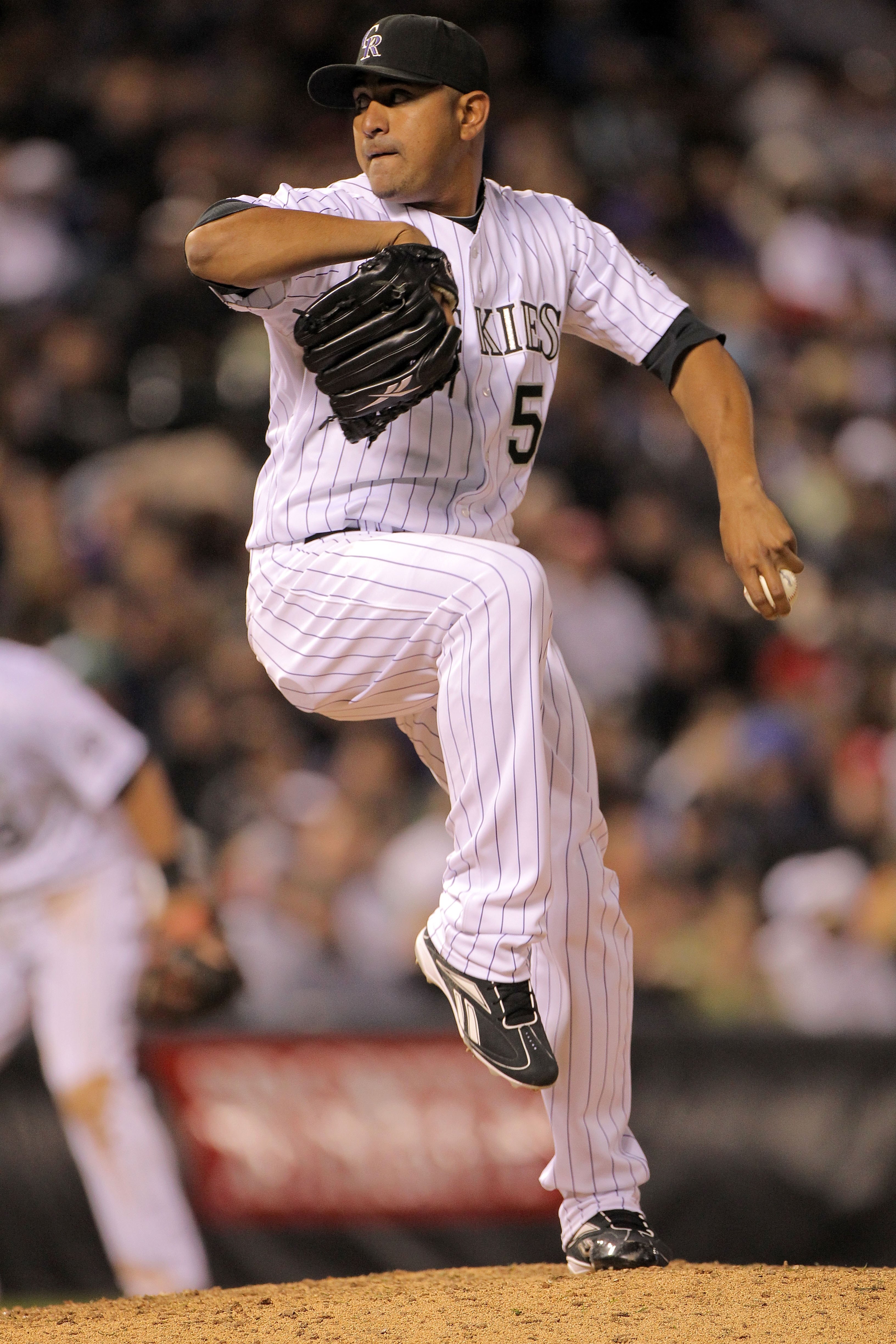 DENVER - APRIL 10:  Relief pitcher Franklin Morales #56 of the Colorado Rockies delivers against the San Diego Padres during MLB action at Coors Field on April 10, 2010 in Denver, Colorado. The Padres defeated the Rockies 5-4 in 14 innings.  (Photo by Dou