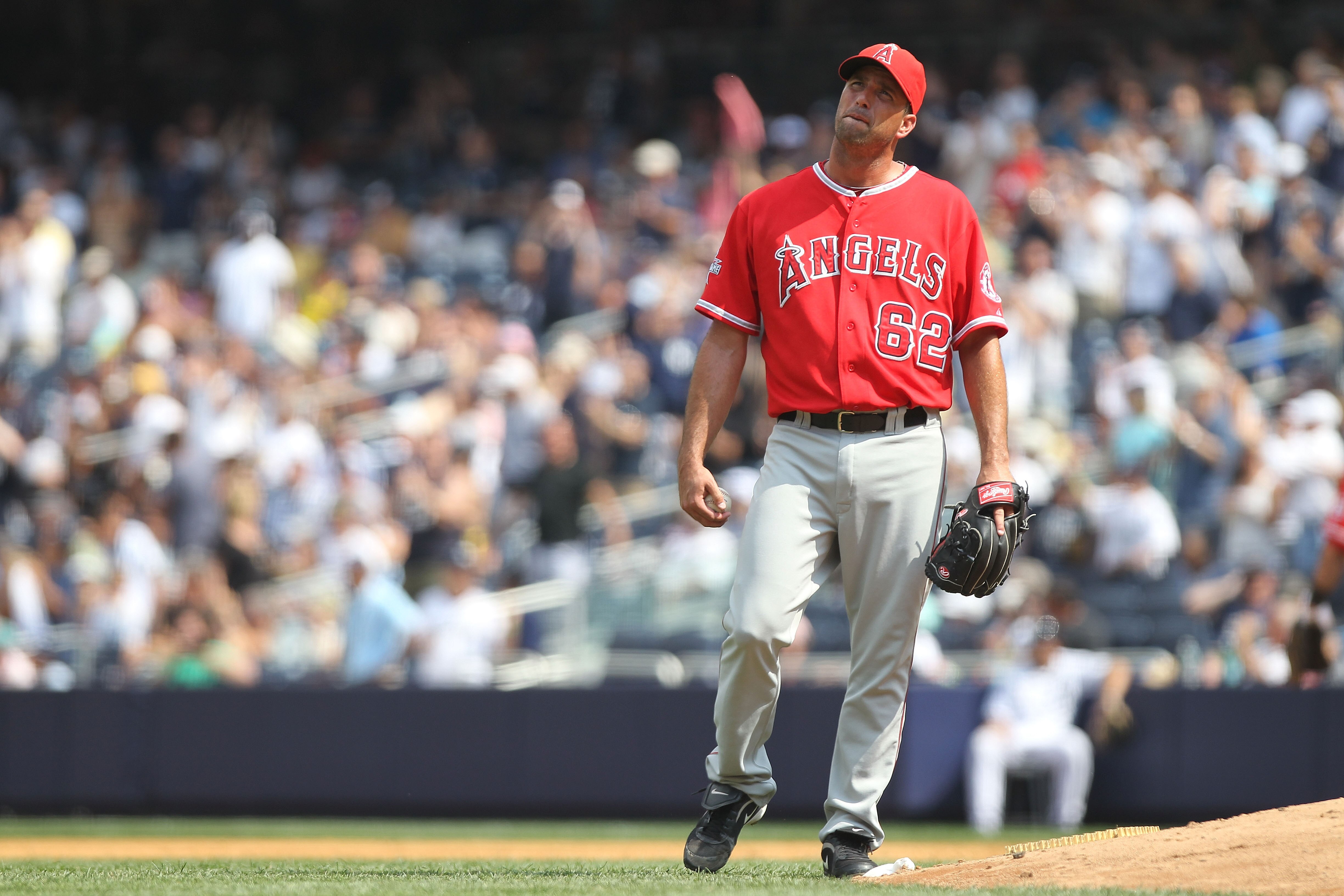 NEW YORK - JULY 21: Scot Shields #62 of the Los Angeles Angels of Anaheim reacts to a solo home run in the seventh inning against the New York Yankees at Yankee Stadium on July 21, 2010 in the Bronx borough of New York City.  (Photo by Nick Laham/Getty Im