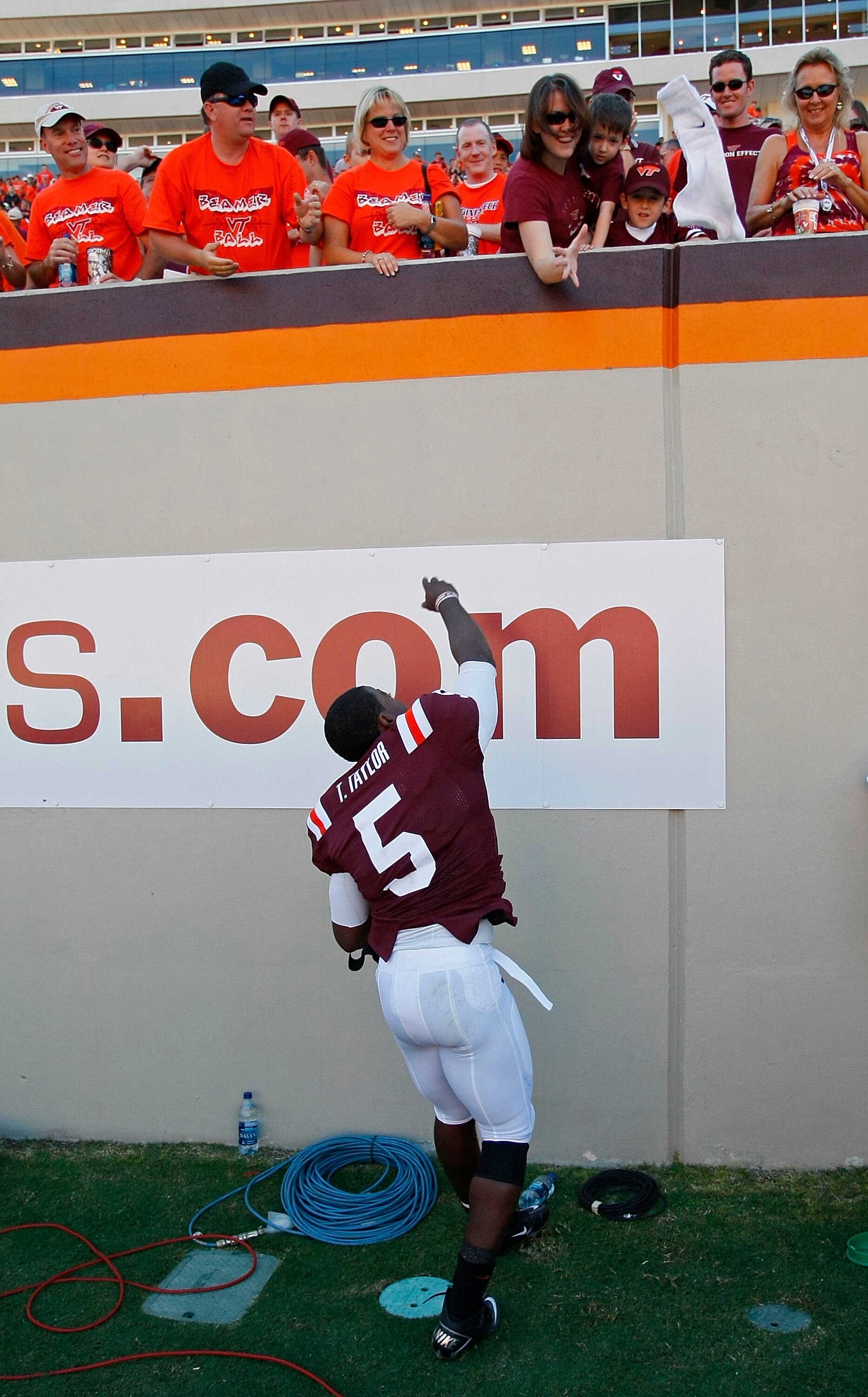 BLACKSBURG, VA - SEPTEMBER 18:  Quarterback Tyrod Taylor #5 of the Virginia Tech Hokies throws a towel into the stands after the Hokies defeated the East Carolina Pirates 49-27 at Lane Stadium on September 18, 2010 in Blacksburg, Virginia.  (Photo by Geof