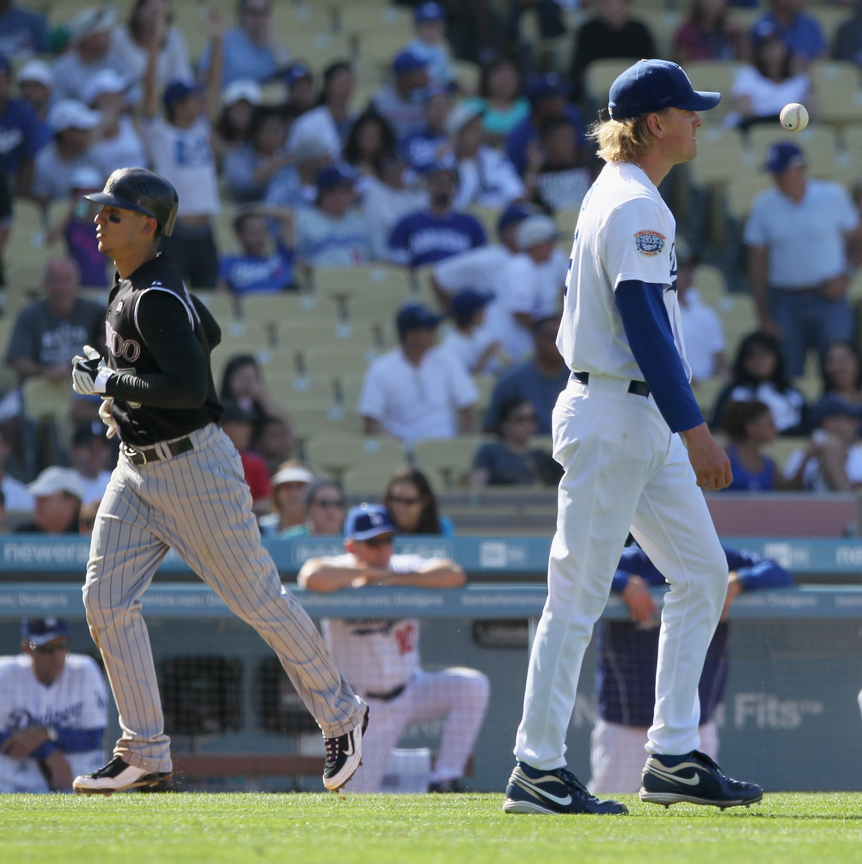 LOS ANGELES, CA - SEPTEMBER 18:  Relief pitcher Jeff Weaver (R) #36 of the Los Angeles Dodgers looks on as Carlos Gonzalez #5 of the Colorado Rockies scores a run on Melvin Mora's grand slam in the eighth inning at Dodger Stadium on September 18, 2010 in 