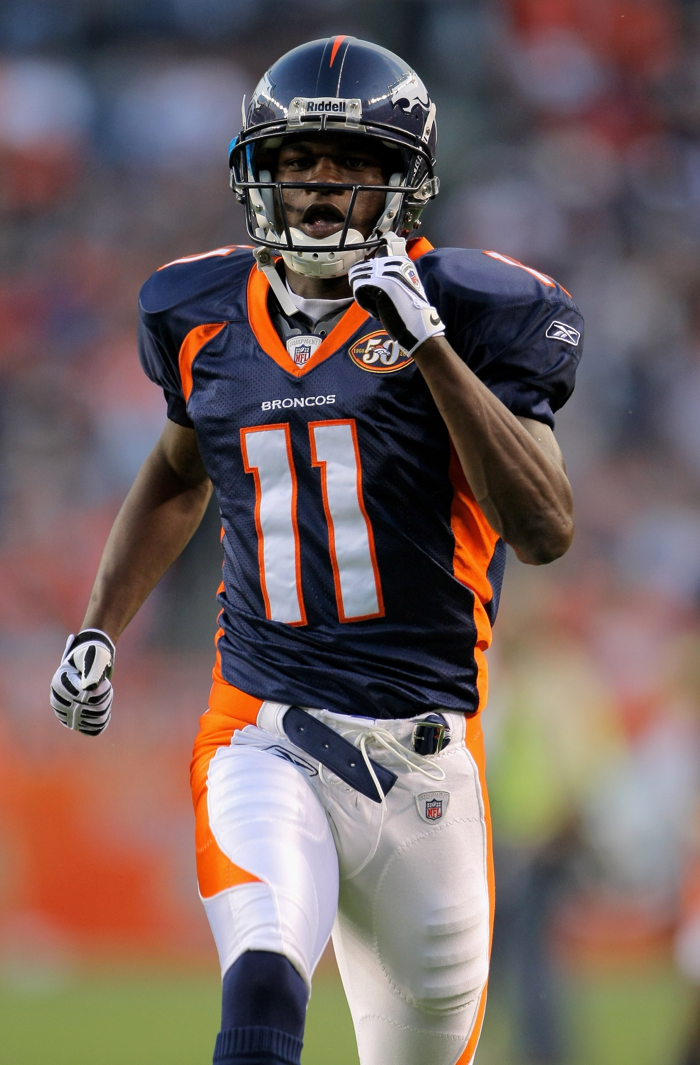 DENVER - SEPTEMBER 03:  Wide receiver Kenny McKinley #11 of the Denver Broncos warms up prior to facing the Arizona Cardinals during preseason NFL action at Invesco Field at Mile High on September 3, 2009 in Denver, Colorado. The Broncos defeated the Card