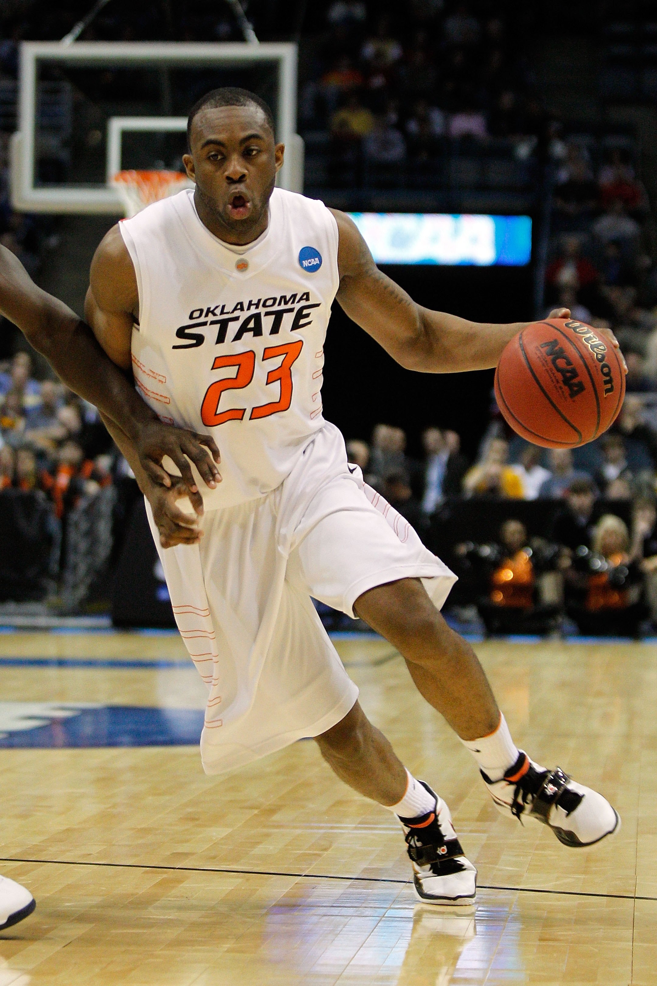 MILWAUKEE - MARCH 19:  James Anderson #23 of the Oklahoma State Cowboys moves the ball against the Georgia Tech Yellow Jackets during the first round of the 2010 NCAA men's basketball tournament at the Bradley Center on March 19, 2010 in Milwaukee, Wiscon