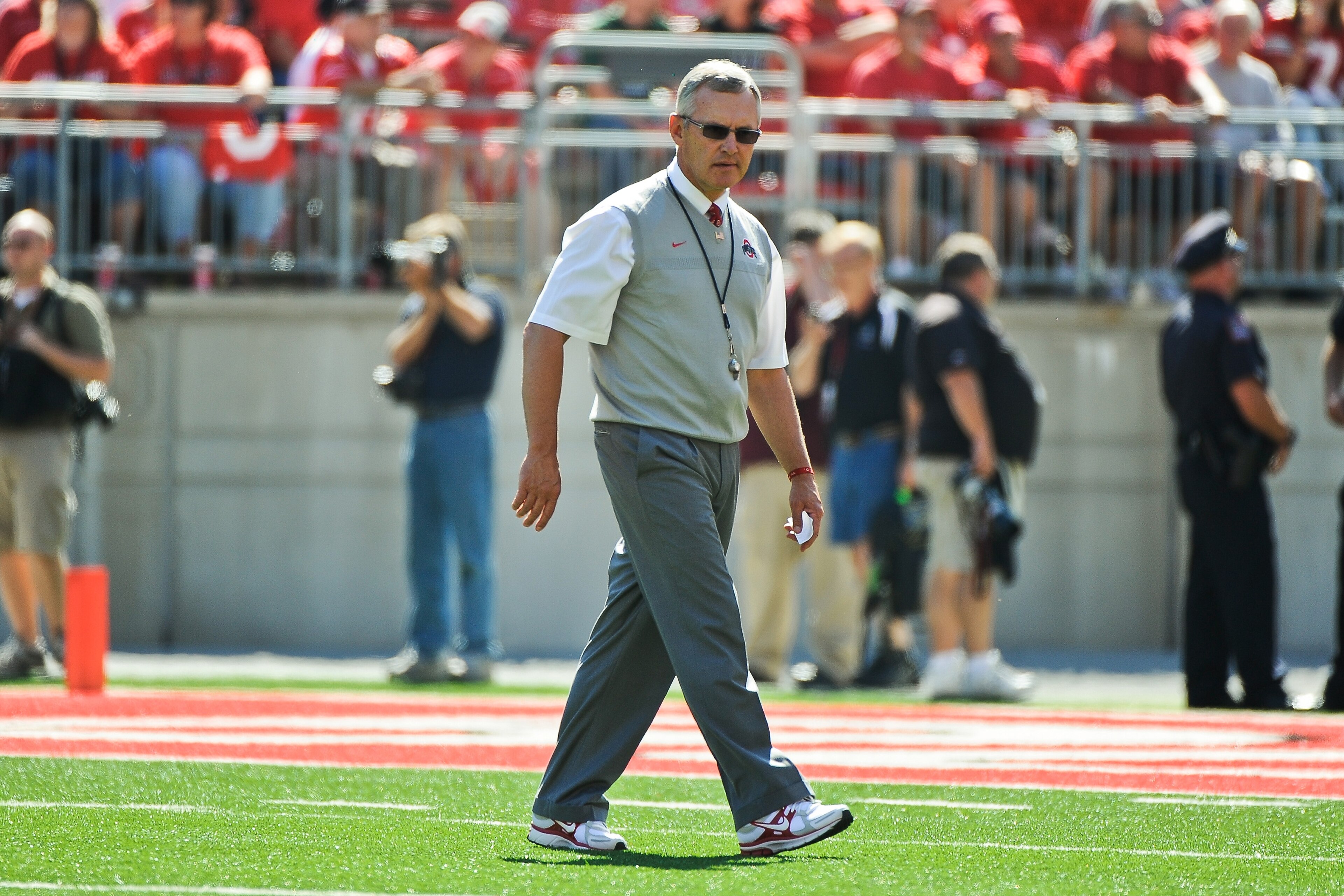 COLUMBUS, OH - SEPTEMBER 18:  Head Coach Jim Tressel of the Ohio State Buckeyes walks across the field before a game against the Ohio Bobcats at Ohio Stadium on September 18, 2010 in Columbus, Ohio.  (Photo by Jamie Sabau/Getty Images)