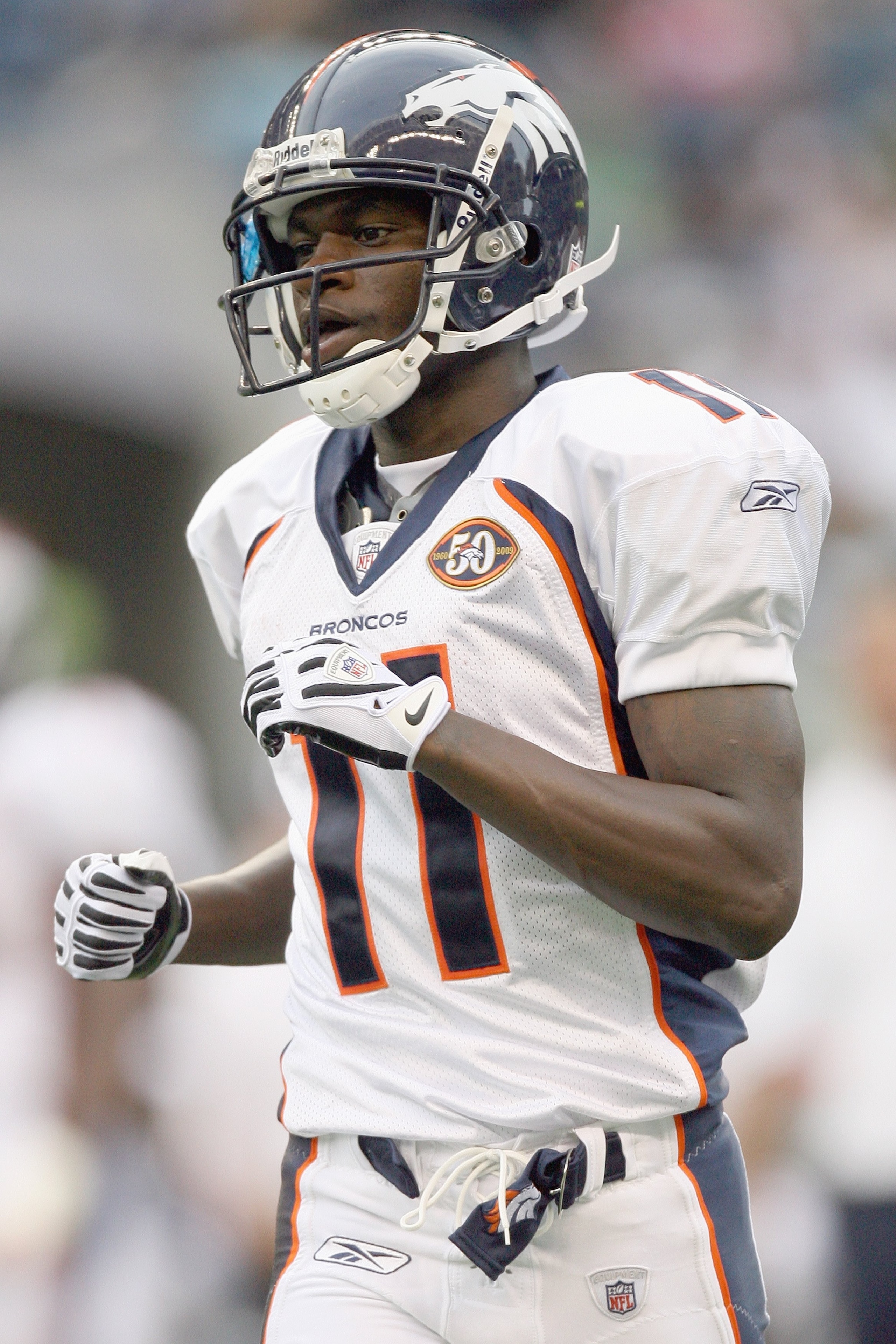 SEATTLE - AUGUST 22:  Kenny McKinley #11 of the Denver Broncos jogs on the field during the game against the Seattle Seahawks on August 22, 2009 at Qwest Field in Seattle, Washington. (Photo by Otto Greule Jr/Getty Images)