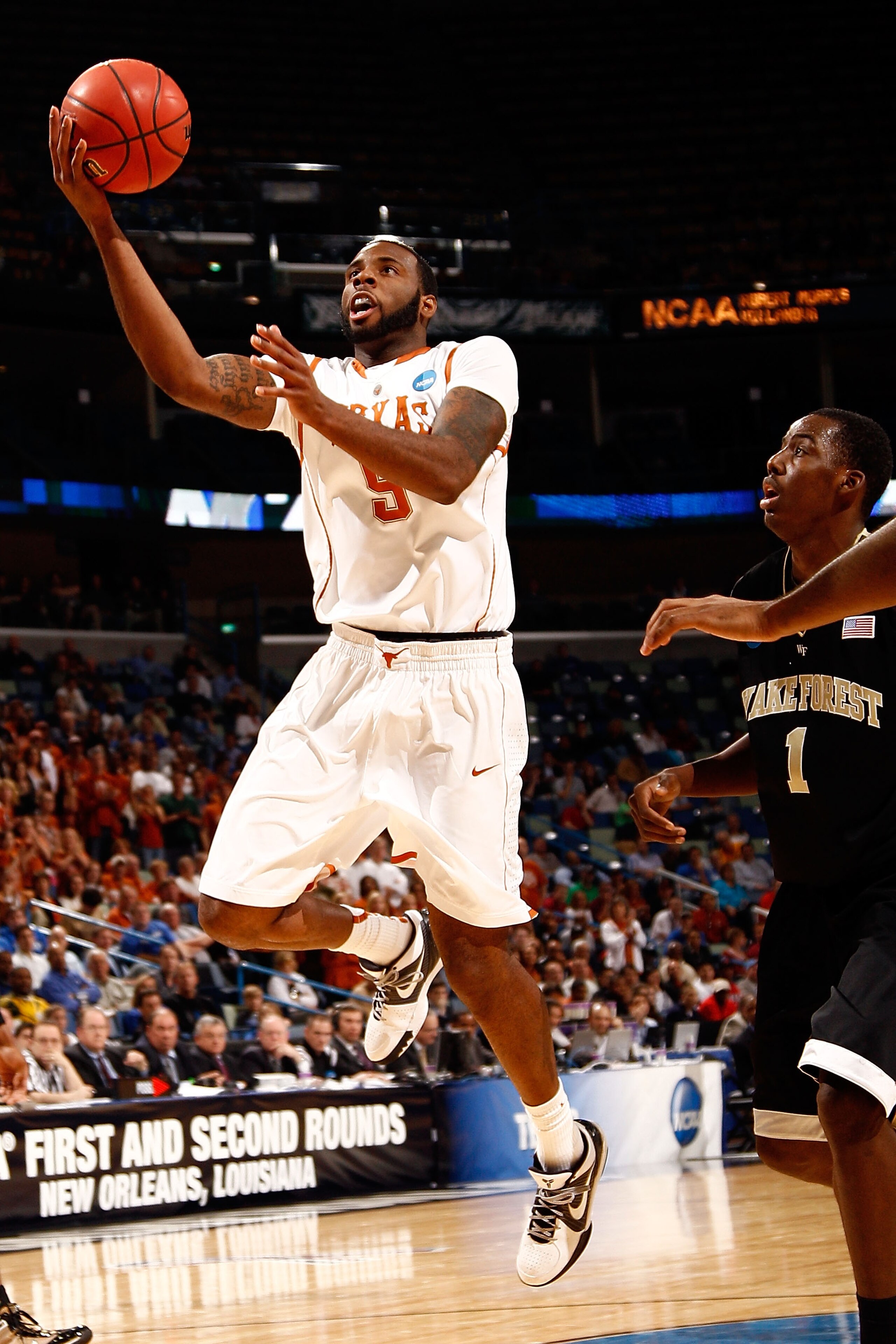 NEW ORLEANS - MARCH 18:  Damion James #5 of the Texas Longhorns shoots the ball over Al-Farouq Aminu #1 of the Wake Forest Demon Deacons during the first round of the 2010 NCAA men's basketball tournament at the New Orleans Arena on March 18, 2010 in New