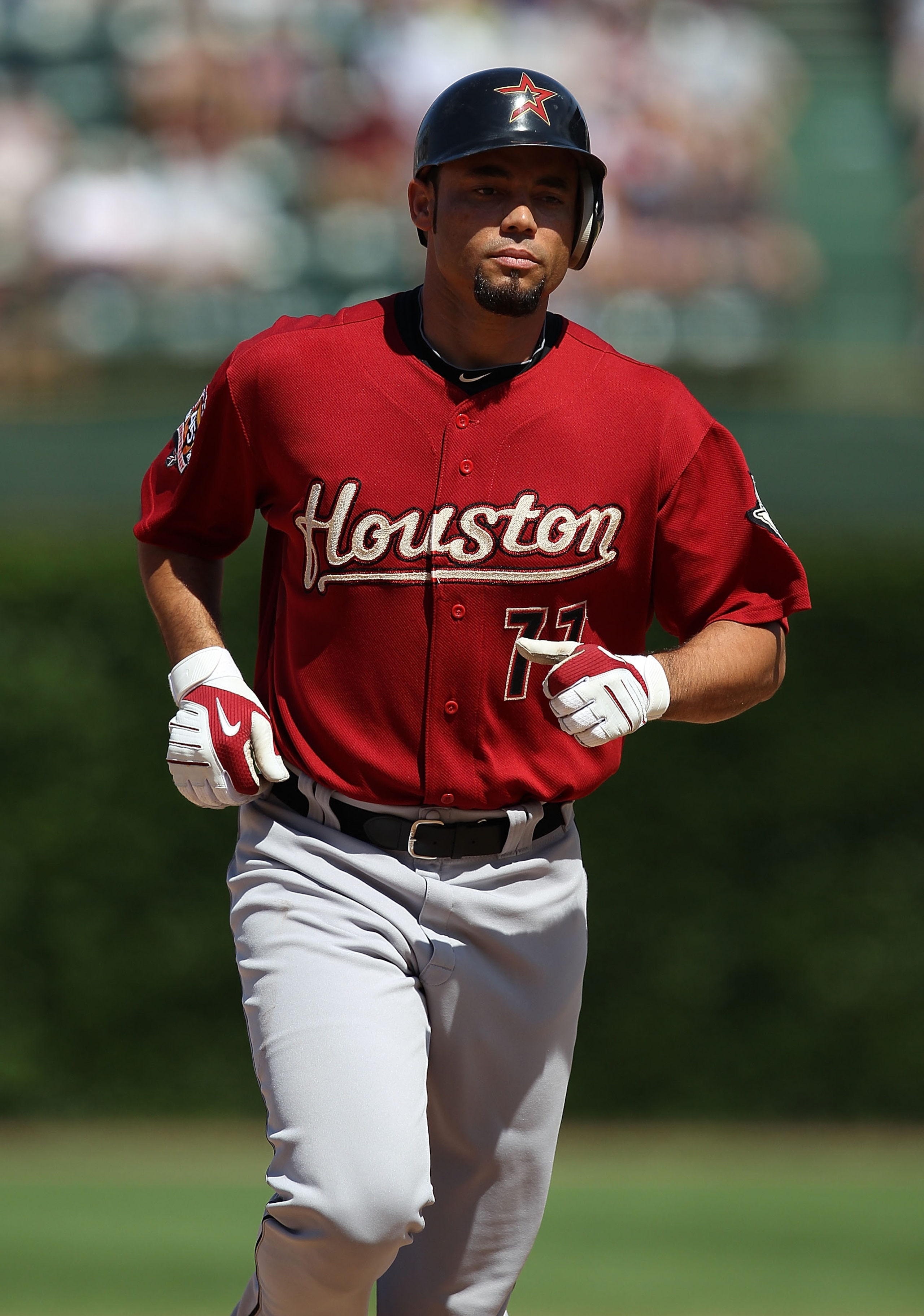 CHICAGO - JULY 21: Pedro Feliz #77 of the Houston Astros runs the bases after hitting a game-tying, pinch-hit home run in the 8th inning against the Chicago Cubs at Wrigley Field on July 21, 2010 in Chicago, Illinois. The Astros defeated the Cubs 4-3 in 1
