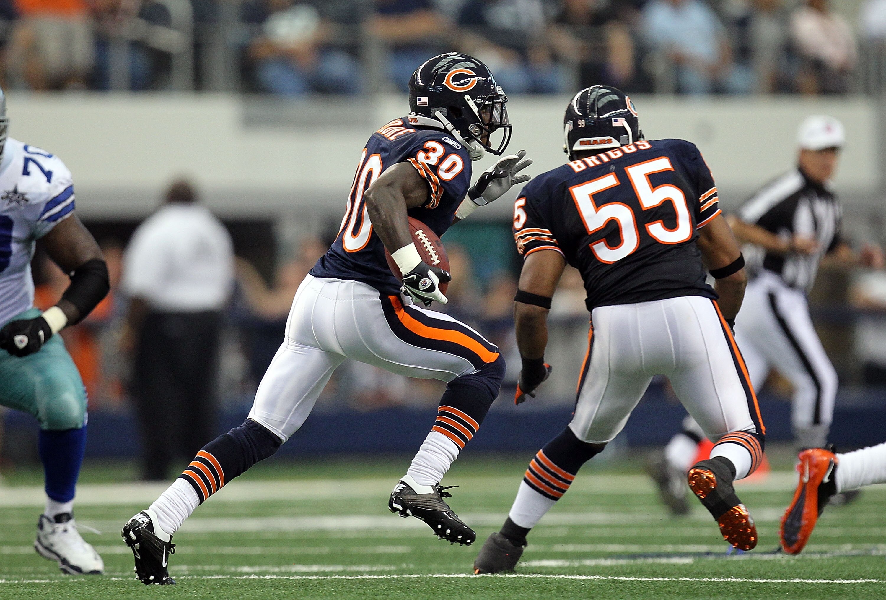 ARLINGTON, TX - SEPTEMBER 19:  Cornerback D.J. Moore #30 of the Chicago Bears runs a pass interception against the Dallas Cowboys in the second quarter at Cowboys Stadium on September 19, 2010 in Arlington, Texas.  (Photo by Ronald Martinez/Getty Images)