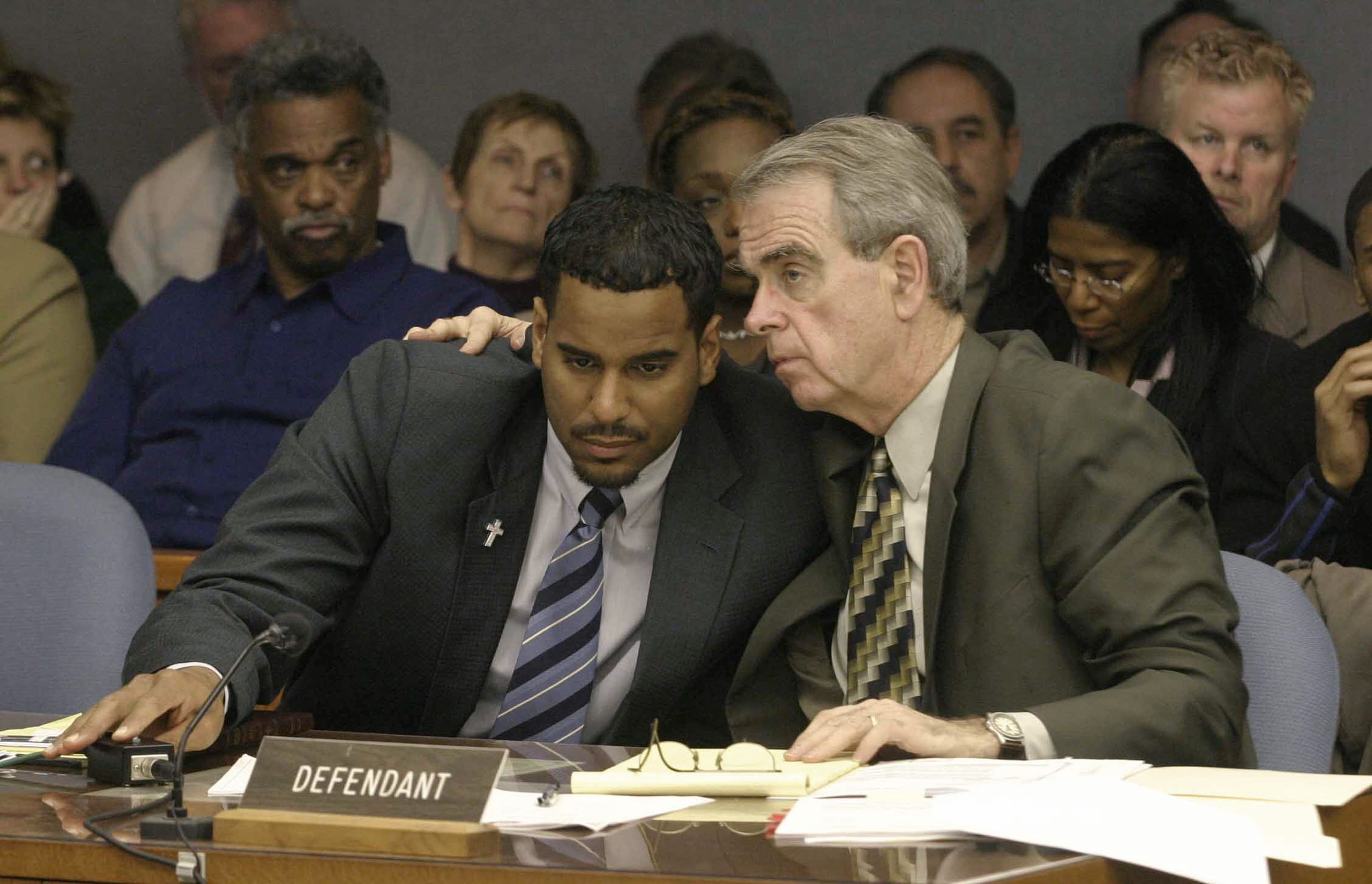 SOMERVILLE, NJ - APRIL 1:  Former New Jersey Nets basketball player Jayson Williams (L) talks with defense attorney Joseph Hayden during Williams' aggravated manslaughter trial at the Somerset County Courthouse April 1, 2004 in Somerville, New Jersey. Wil