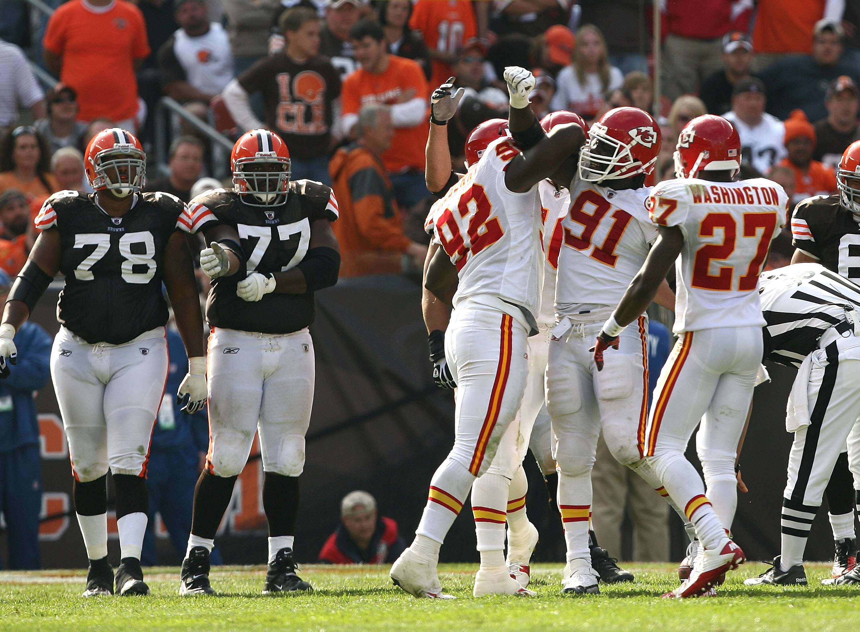 CLEVELAND - SEPTEMBER 19:  Defenders Wallace Gilberry #92, Tamba Hali #91 and Donald Washington #27 of the Kansas City Chiefs celebrate a sack against the Cleveland Browns at Cleveland Browns Stadium on September 19, 2010 in Cleveland, Ohio.  (Photo by Ma