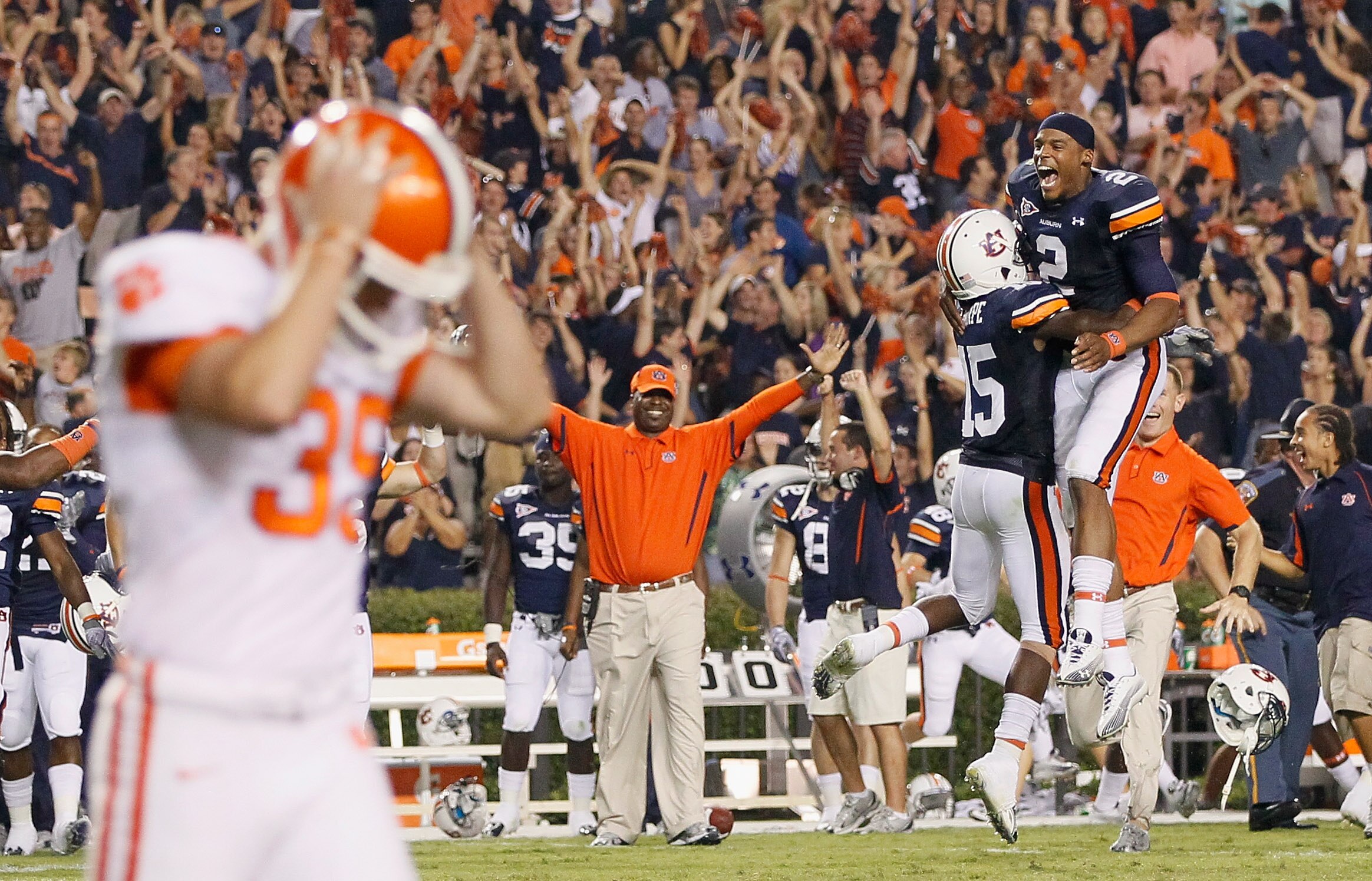 AUBURN, AL - SEPTEMBER 18:  Quarterback Cameron Newton #2 and Neiko Thorpe #15 of the Auburn Tigers celebrate after Chandler Catanzaro #39 of the Clemson Tigers missed a field goal in overtime to give the Auburn Tigers a 27-24 win at Jordan-Hare Stadium o